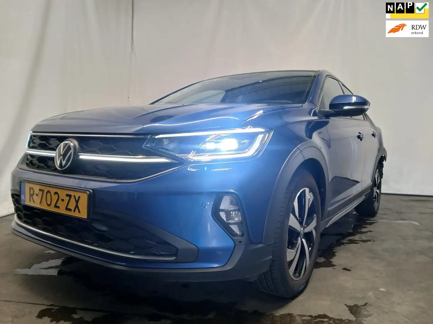 Volkswagen Taigo 1.0 TSI Style - Airco - Achter Schade - WOK Blauw - 1
