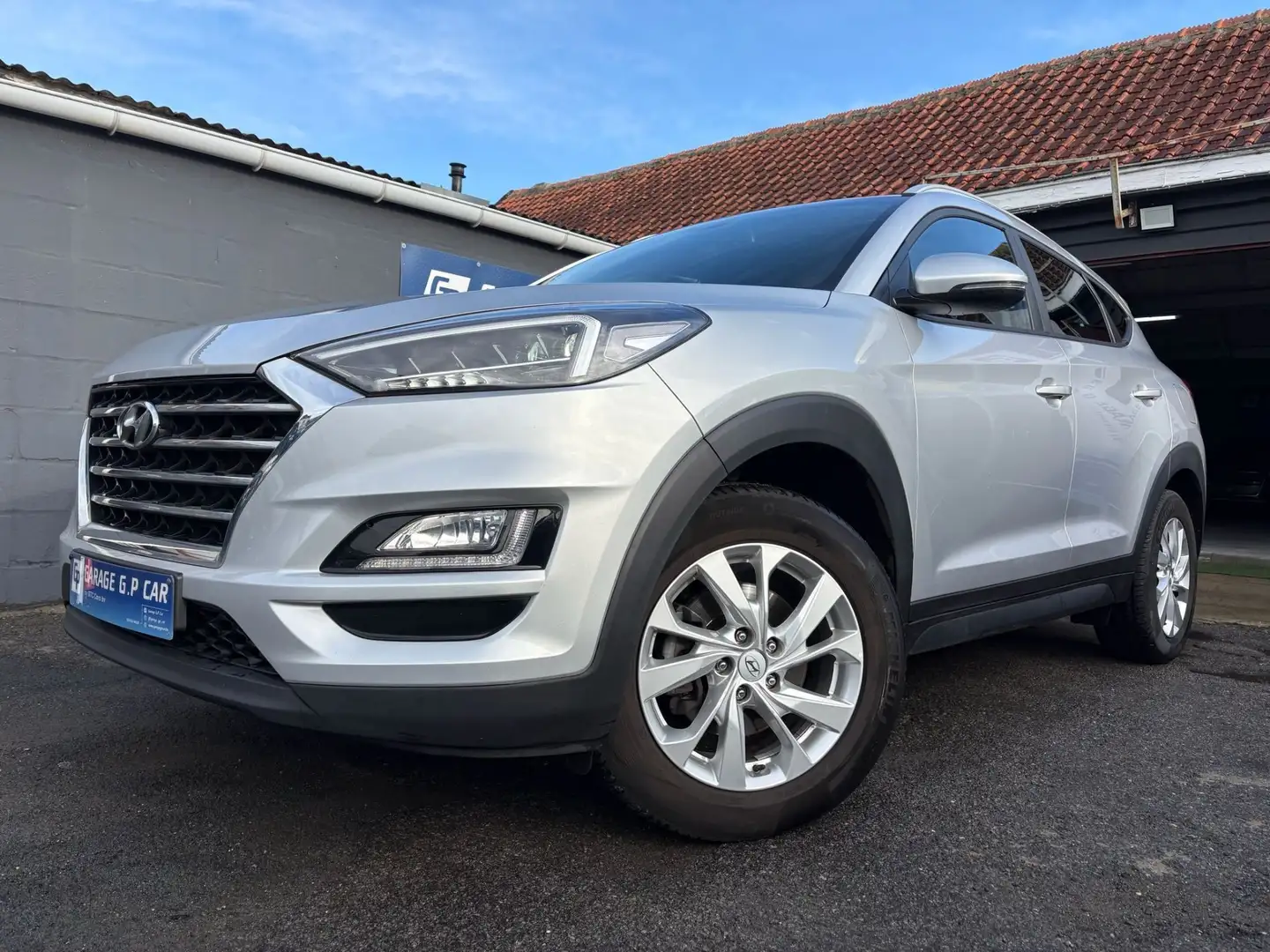 Hyundai TUCSON 1.6 GDi 2WD Premium ISG Grijs - 1