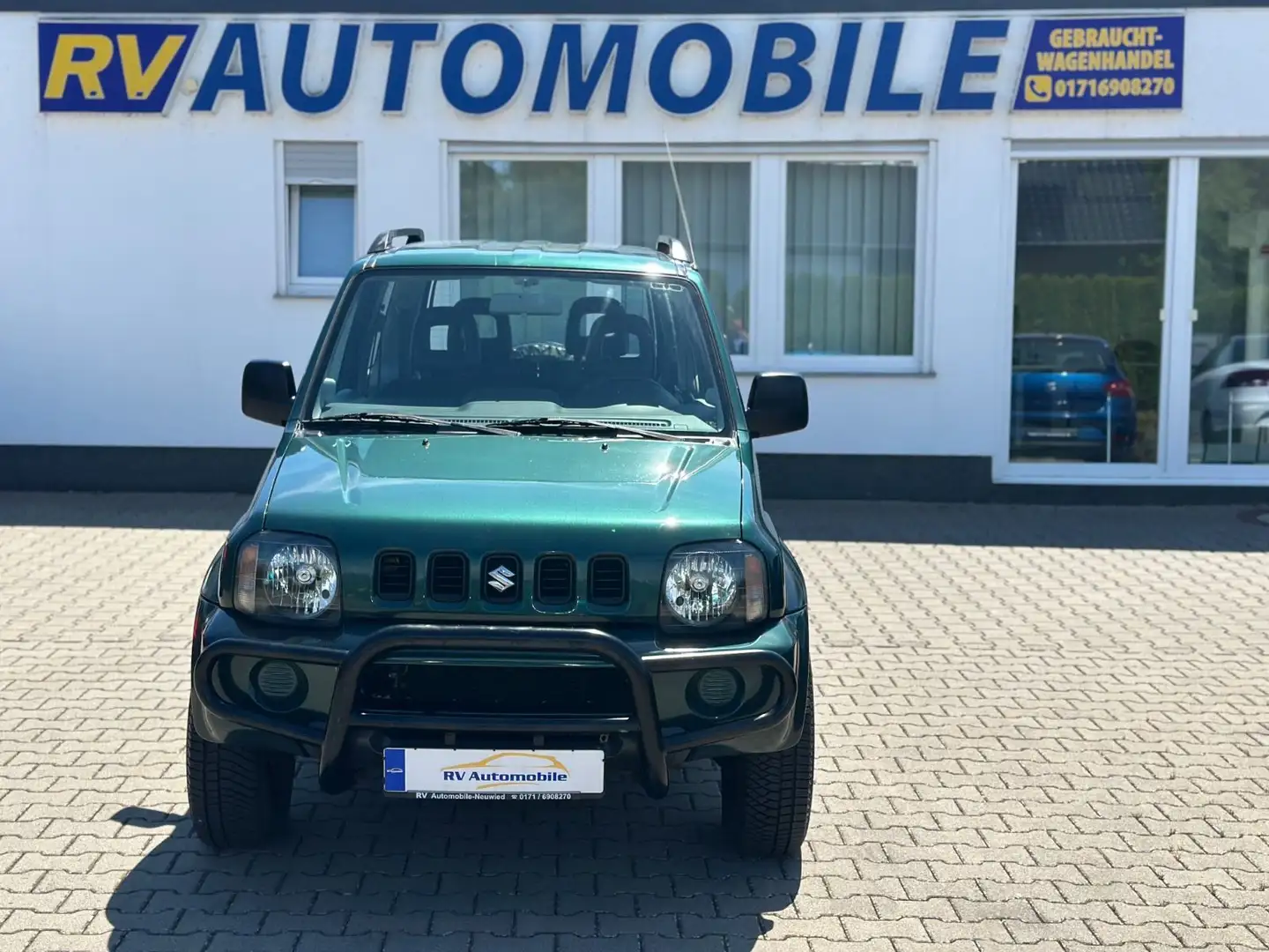 Suzuki Jimny 1.3 4WD**1-HAND*NAVI*KLIMA*STDHZ*AHK*TOP** Grün - 1
