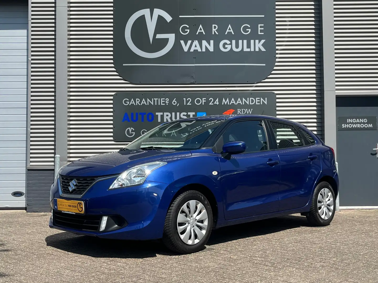 Suzuki Baleno 1.2 90PK Airco,Bluetooth,Isofix,Parkeersensoren,Us Blauw - 1