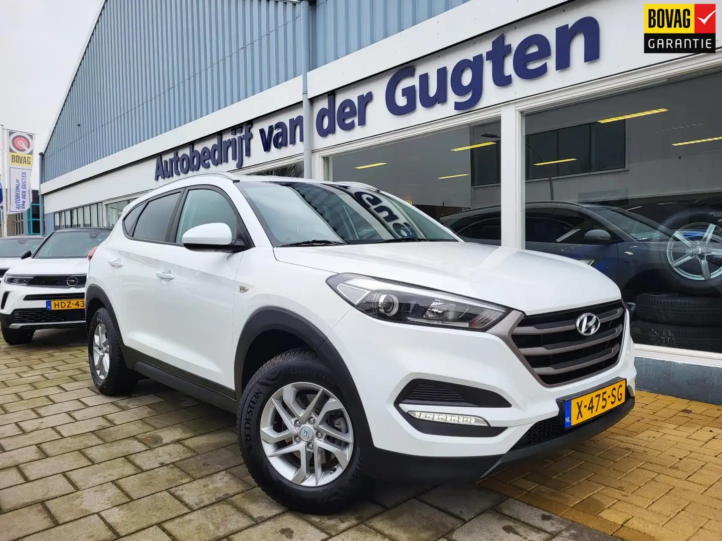 Hyundai TUCSON 1.6 GDi i-Drive / Stoelverwarming / 58.000 Km / Bl Wit - 1