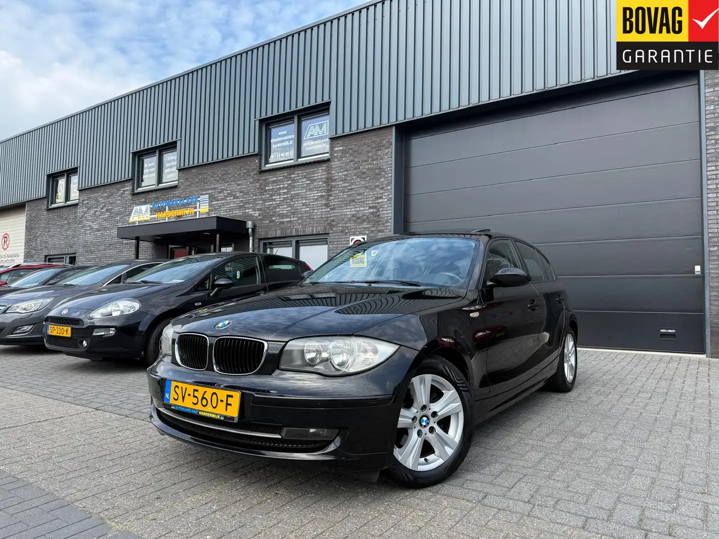 BMW 116 1-serie 116i High Executive | 12MND GARANTIE | SCH Schwarz - 1
