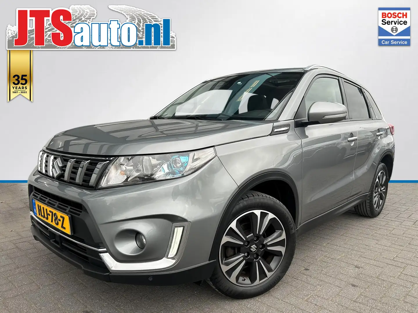 Suzuki Vitara 1.0 Boosterjet, Carplay, Pano, Trekhaak, Camera. Gris - 1