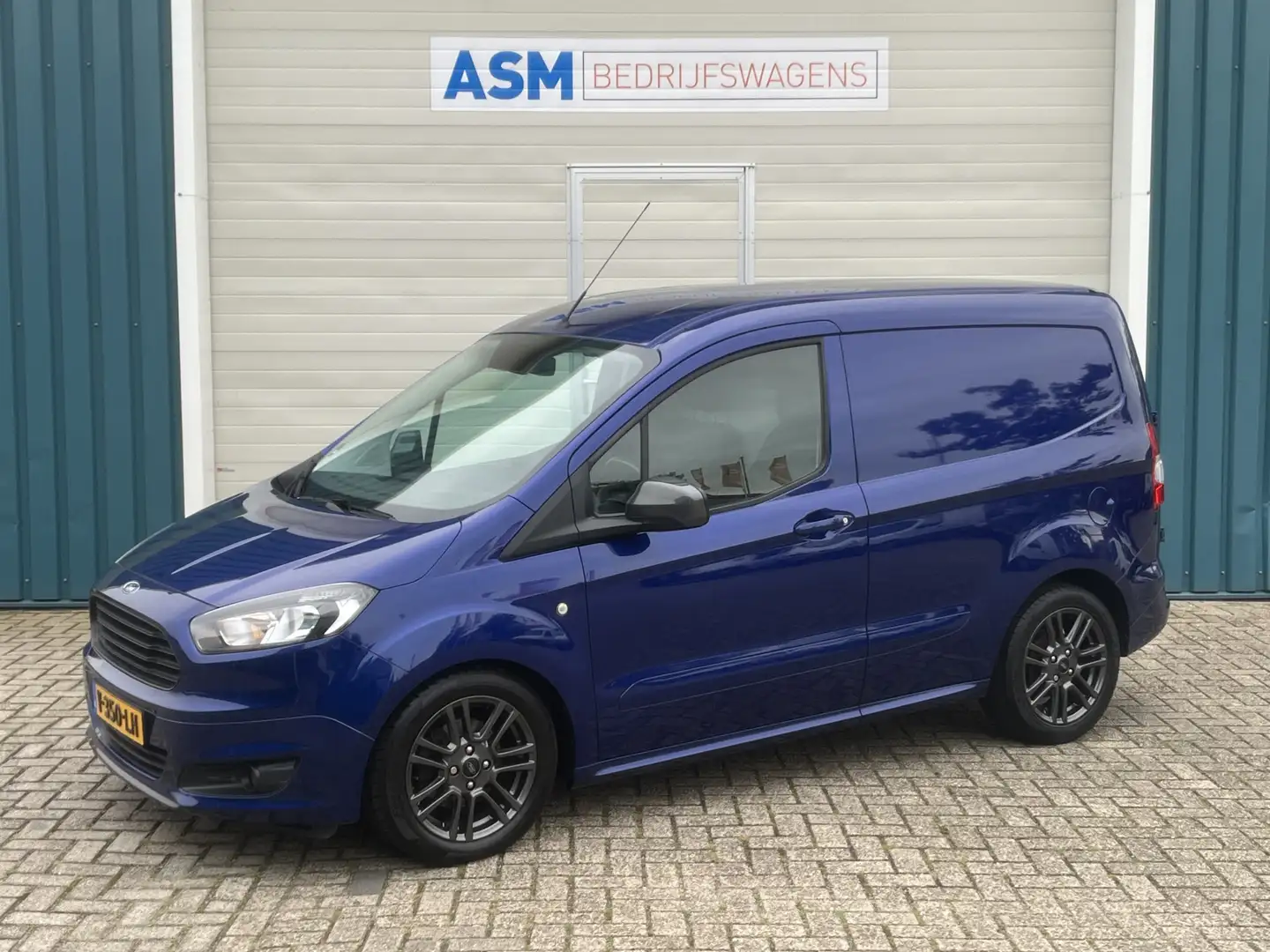 Ford Transit Courier 1.5 96Pk TDCI Sport / Cruise / Airco / SCHUIFDEUR Blauw - 1