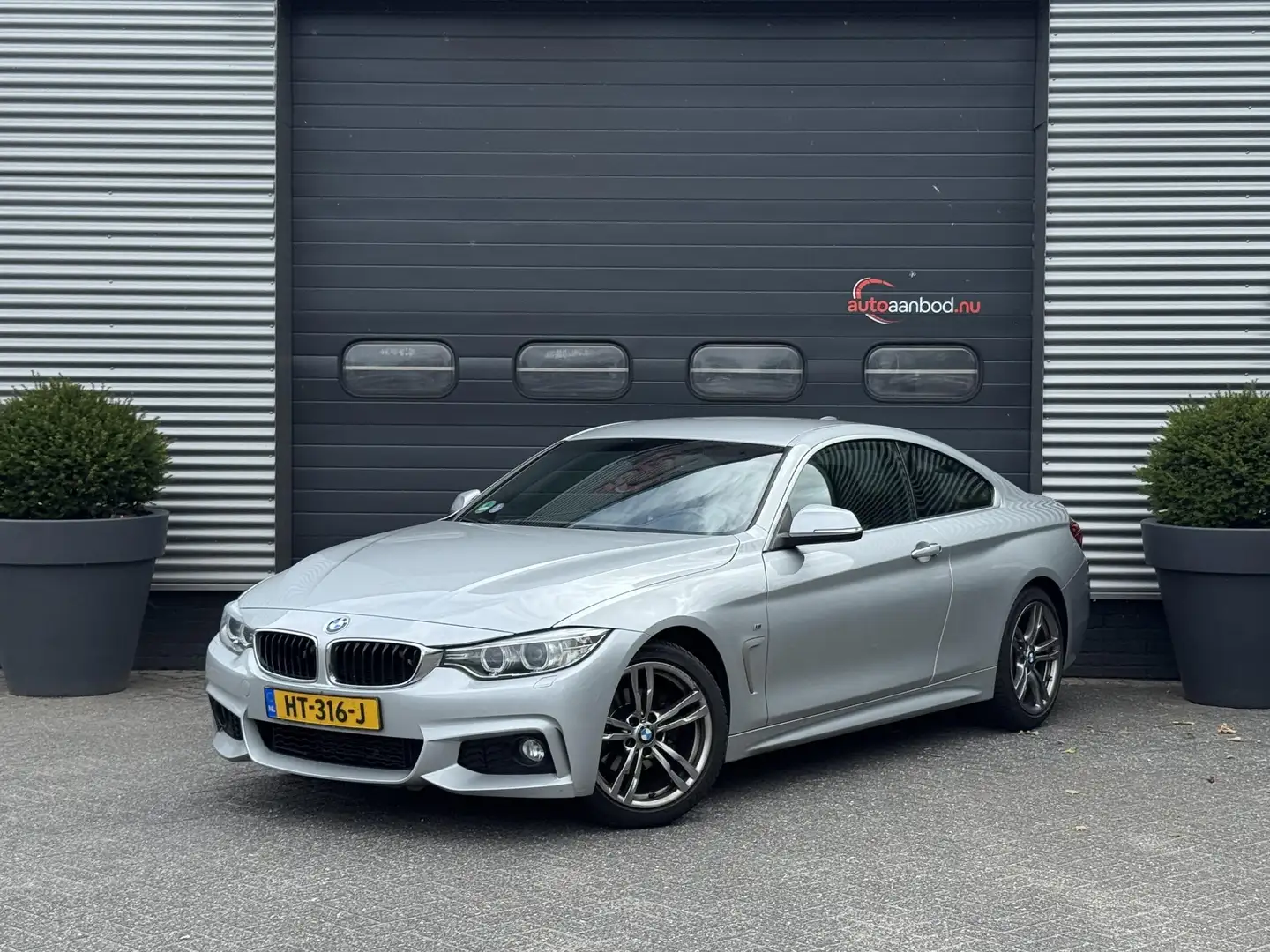 BMW 420 4-serie Coupé 420i High Executive M-Sport | Naviga Grijs - 1