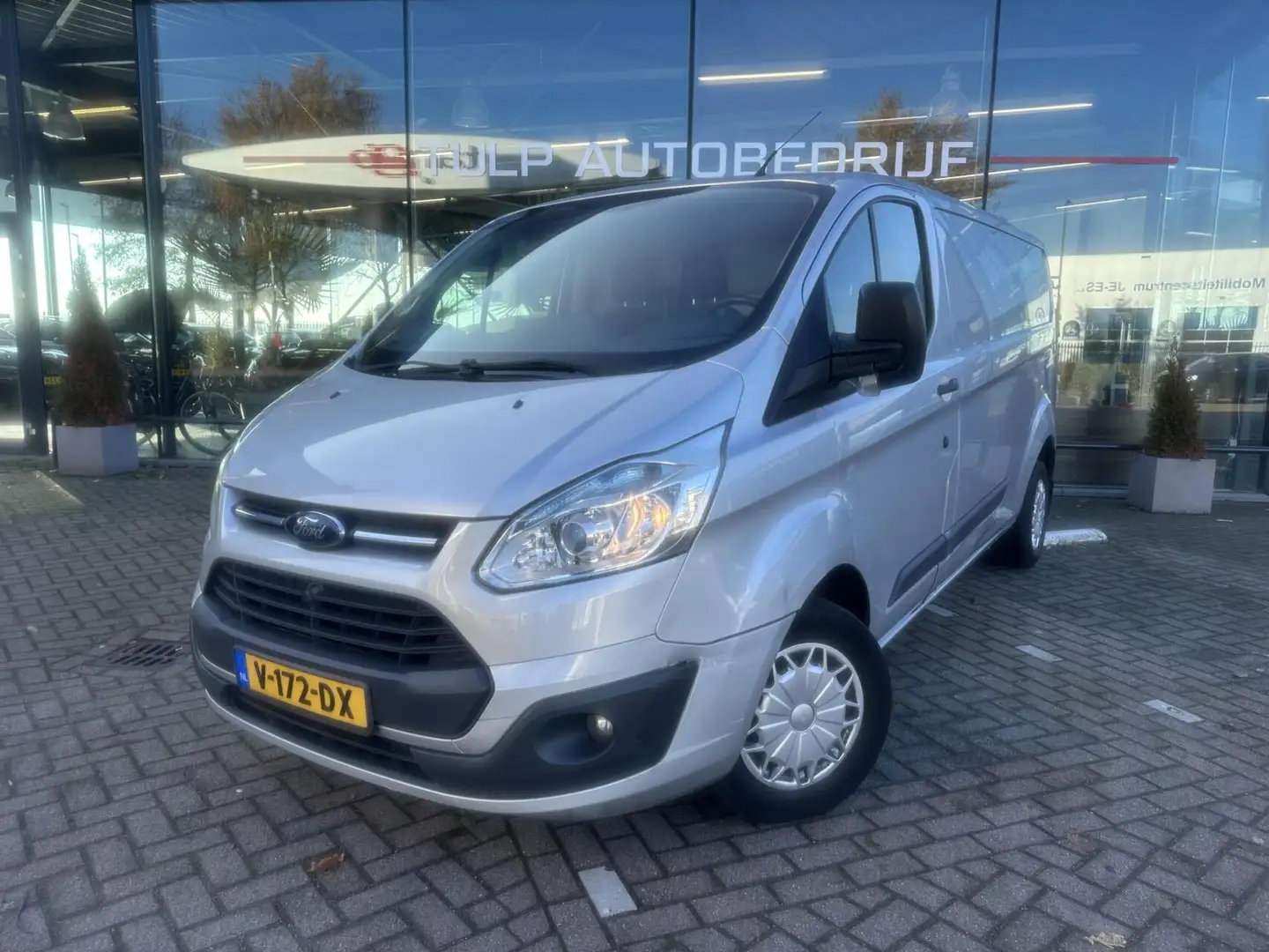 Ford Transit Custom 330 2.2 TDCI L2H1 Ambiente Airco Silber - 1