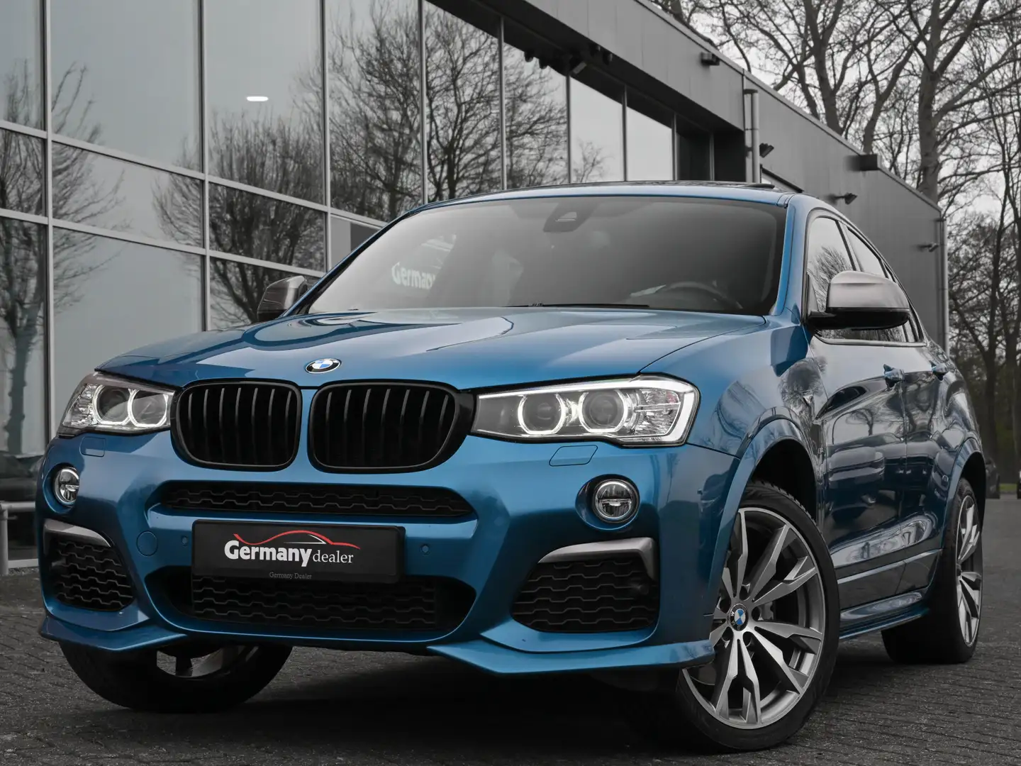 BMW X4 M40i 361pk M-Sport High Executive Schuifdak Tr-Haa Blauw - 1