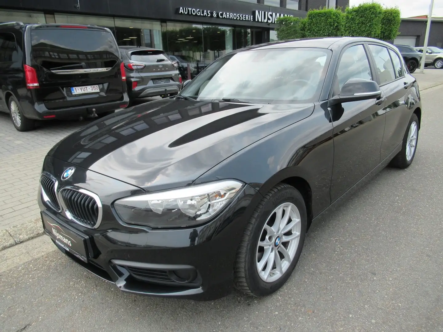 BMW 114 d - 5deurs - Navi - Airco - PDC - All weather Zwart - 1