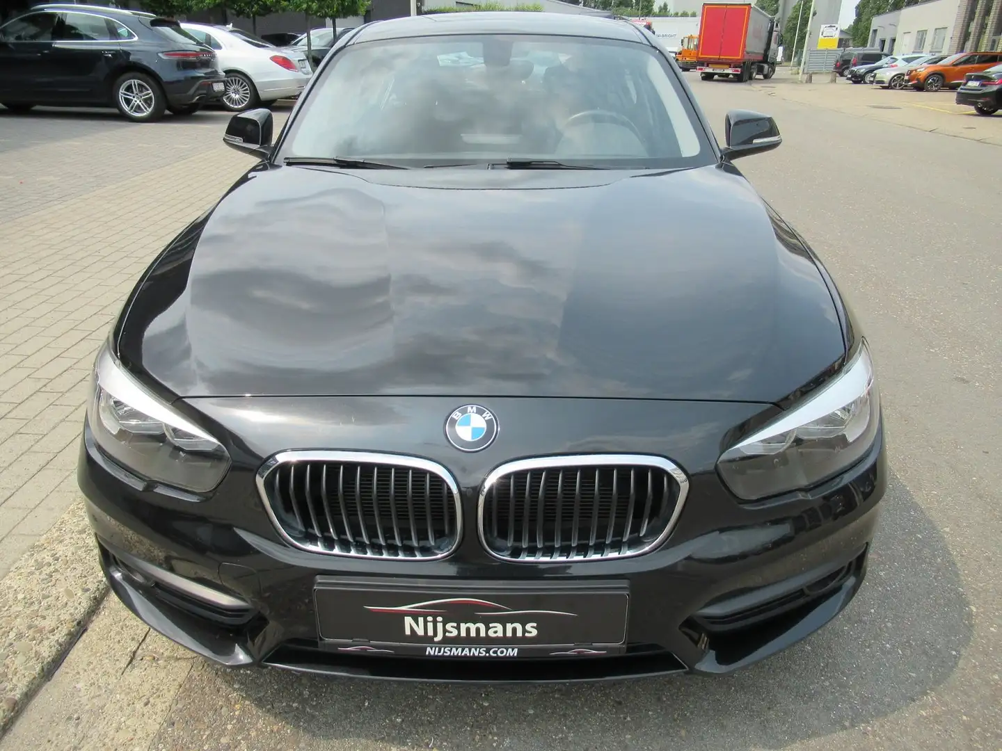 BMW 114 d - 5deurs - Navi - Airco - PDC - All weather Zwart - 2