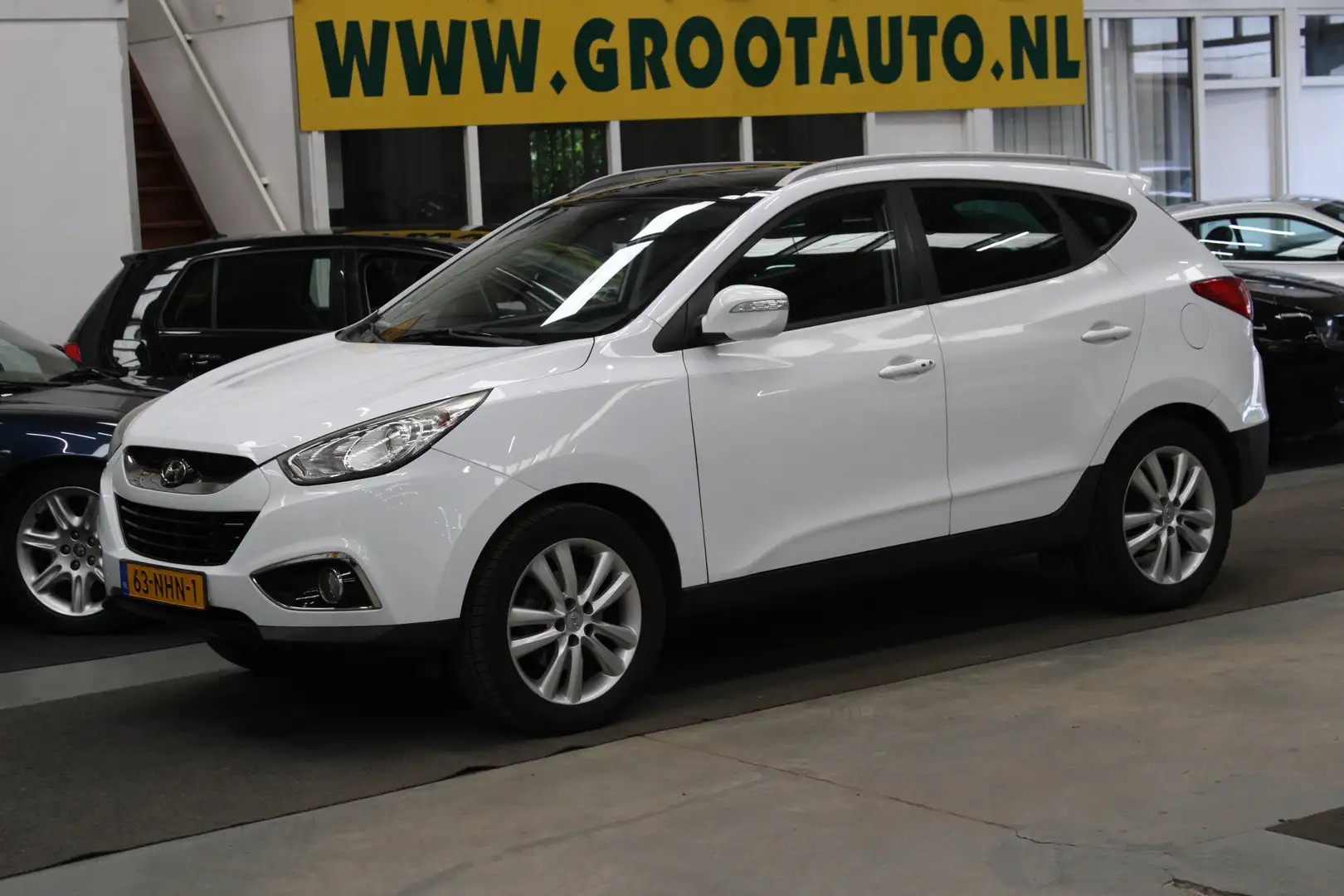 Hyundai iX35 2.0i i-Catcher Panoramadak, NAP, Airco, Navi, Stoe Wit - 1