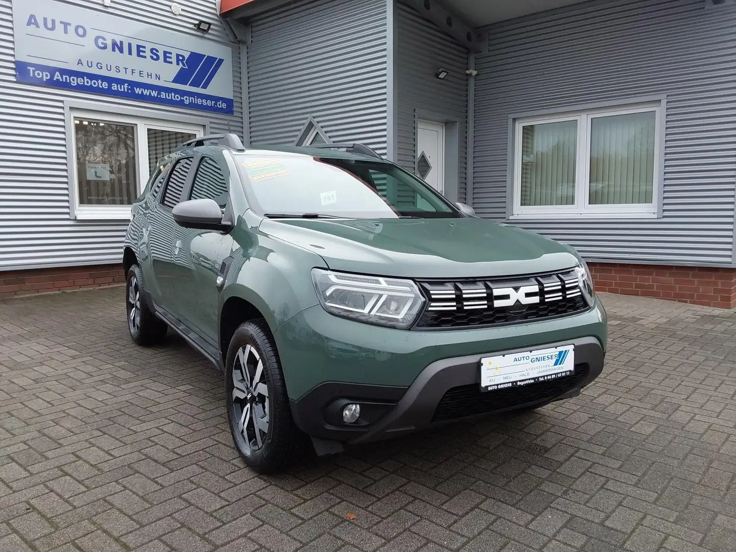 Dacia Duster TCe 150 4x2 Journey APP/LED/PDC/NAV/KAM 110 kW ... Grün - 1