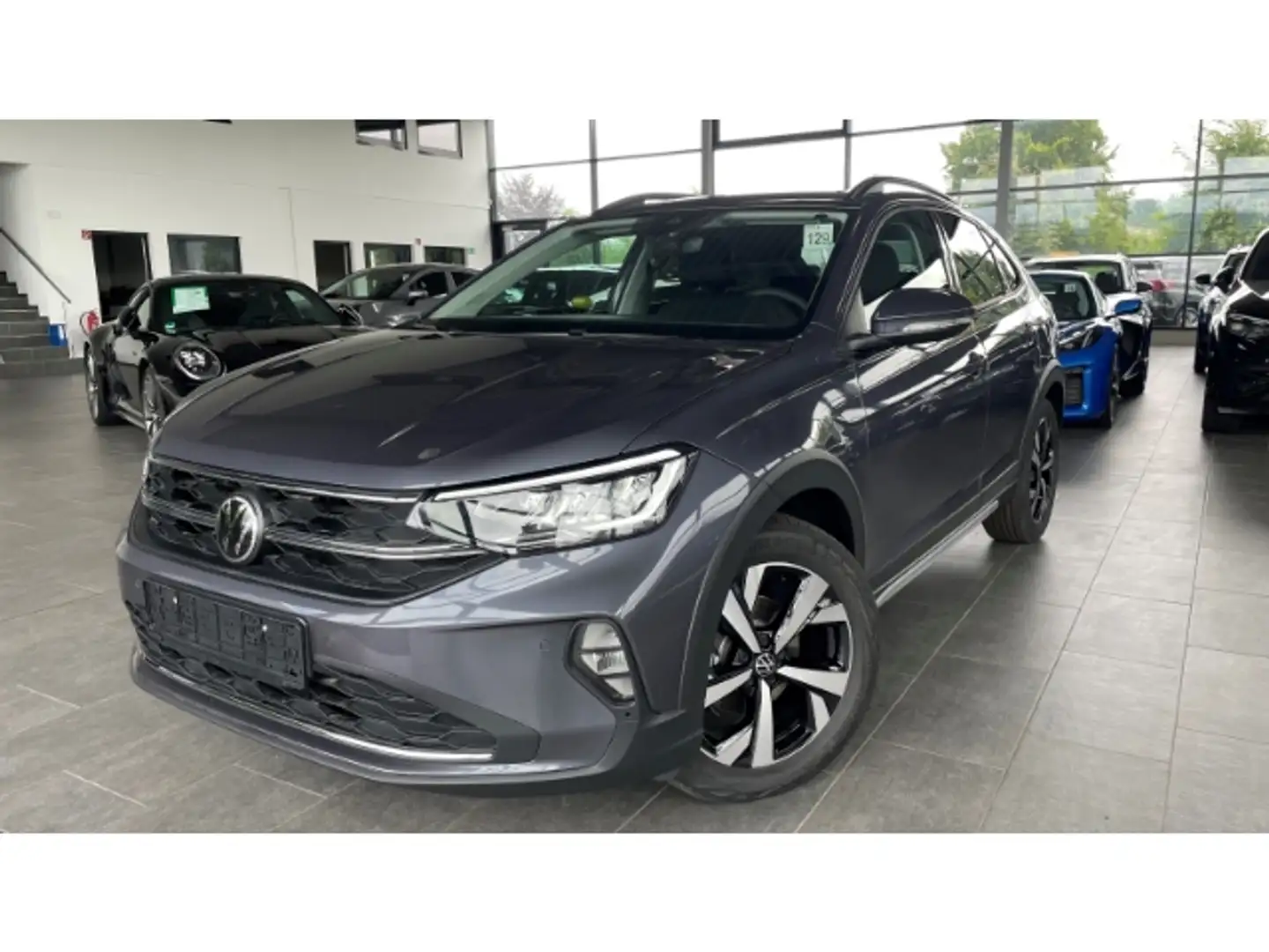 Volkswagen Taigo Style 1.0 TSI LED AHK Kamera ACC SitzHZG APP Conne Grau - 1