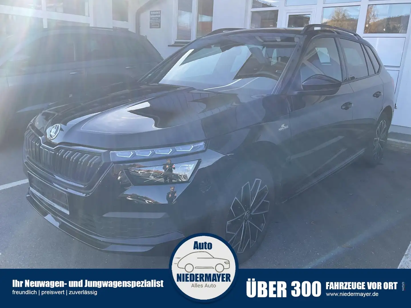 Skoda Kamiq 1.5 TSI DSG Monte Carlo, AHK, Navi, Pano, 1. Hand Schwarz - 1