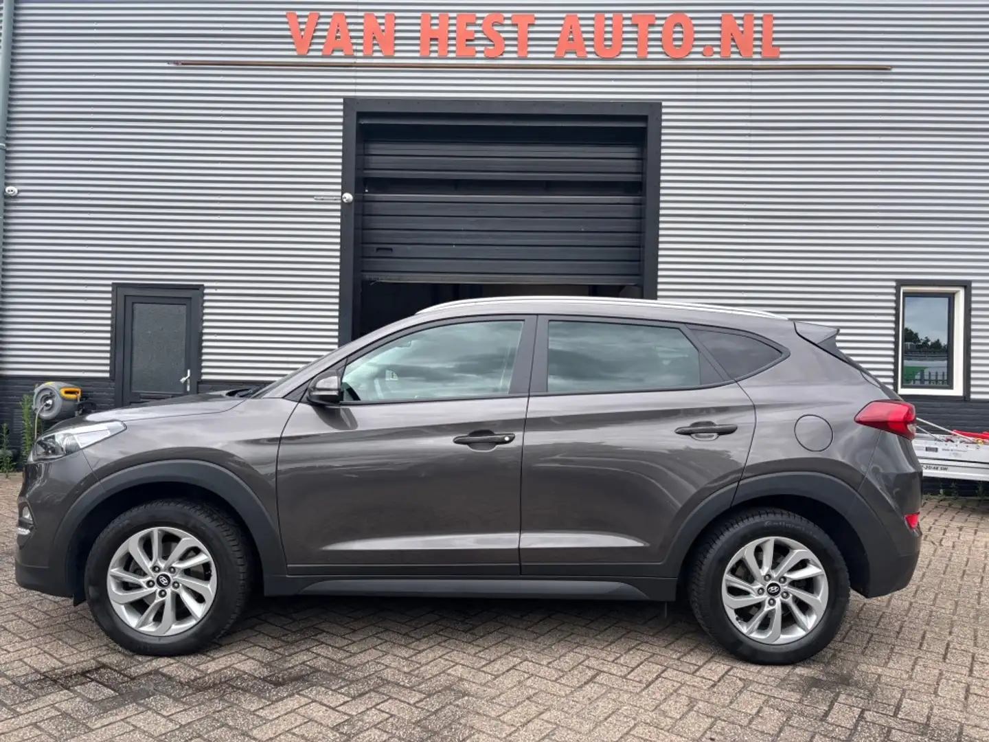 Hyundai TUCSON 1.6 GDi Premium 6 MND GAR | LEER | NAVI | CLIMA | Bruin - 2