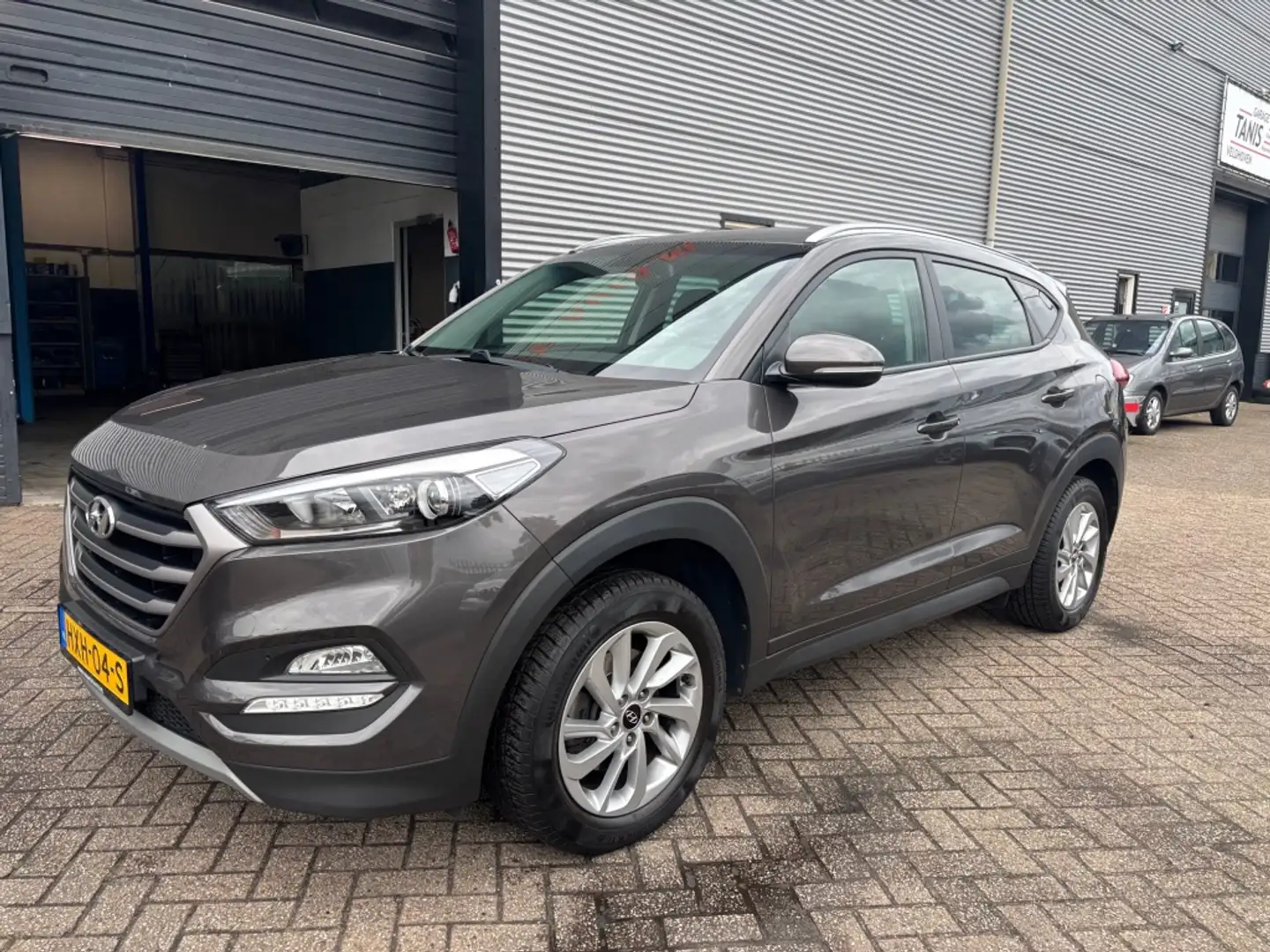 Hyundai TUCSON 1.6 GDi Premium 6 MND GAR | LEER | NAVI | CLIMA | Bruin - 1