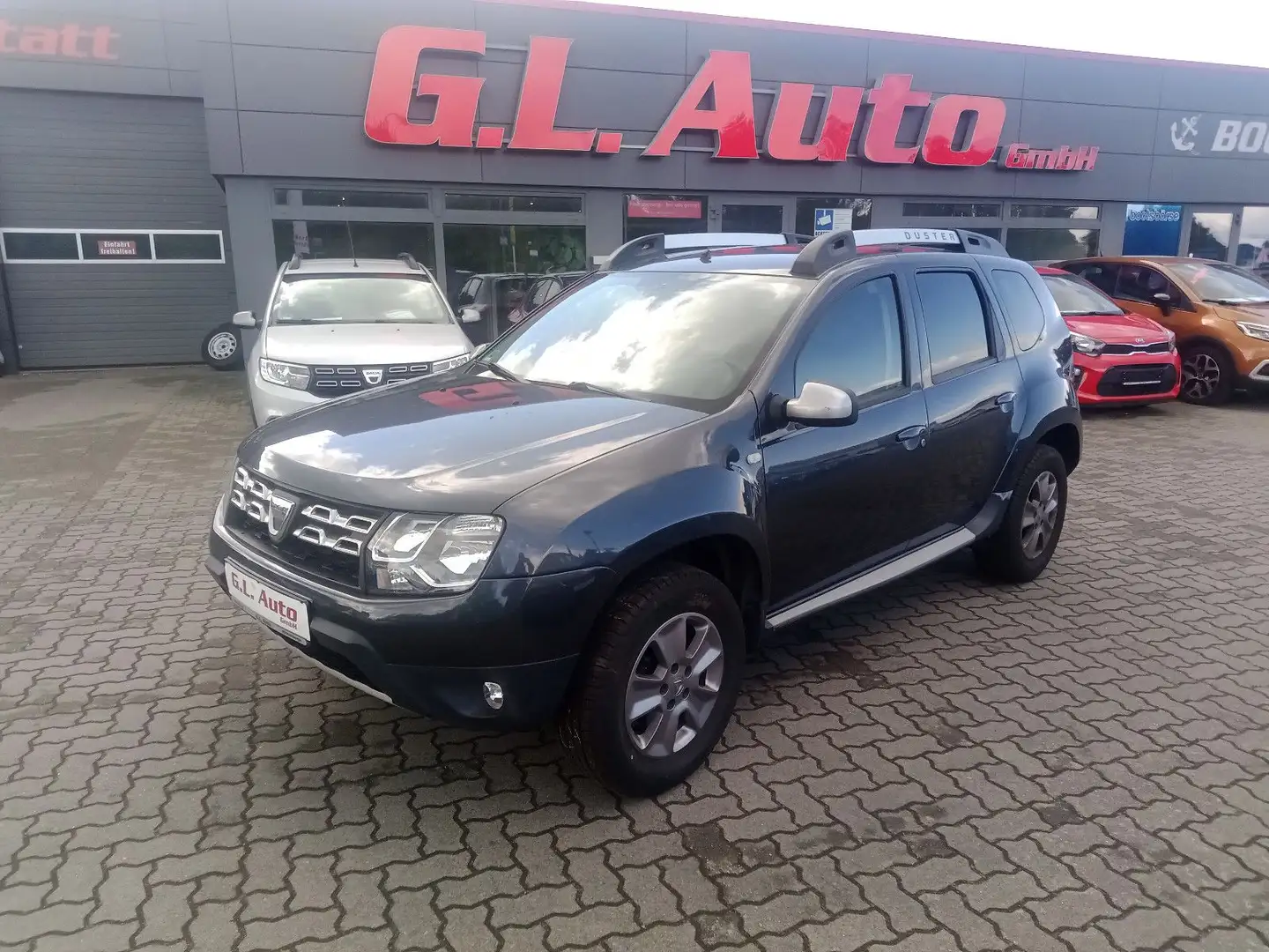 Dacia Duster I Prestige 4x2/AHK/KAM/NAVI/PDC/TEMPO/SH Gris - 1