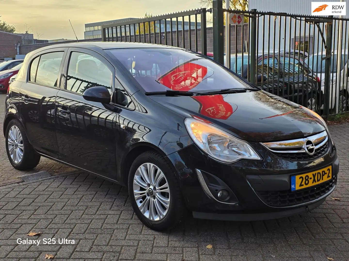 Opel Corsa 1.2-16V Anniversary Edition 1e eigenaar dealer ond Zwart - 1
