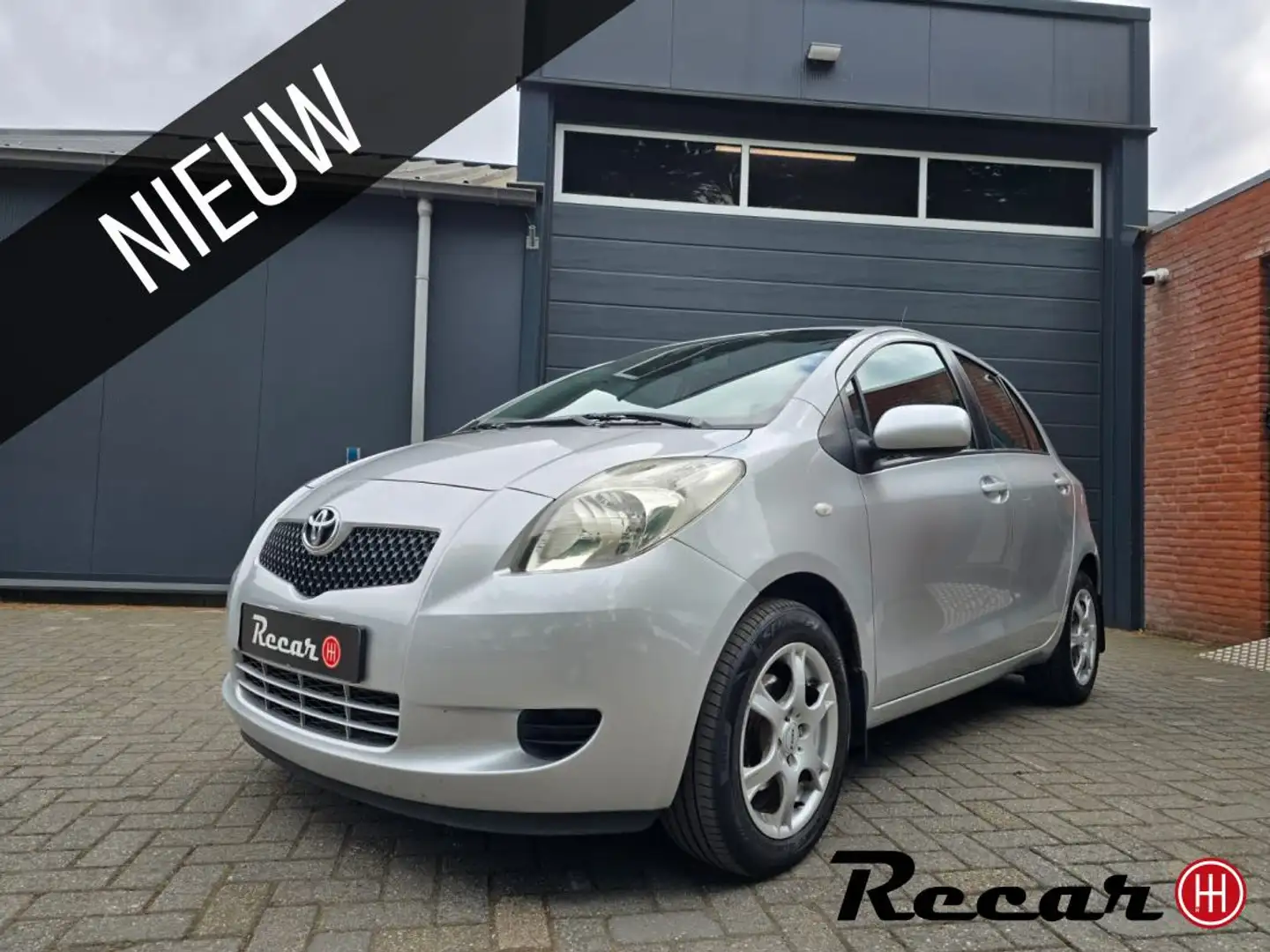 Toyota Yaris 1.3 VVTi Sol/Airco/5Drs/Pdc/Trekhaak/Apk Gris - 1
