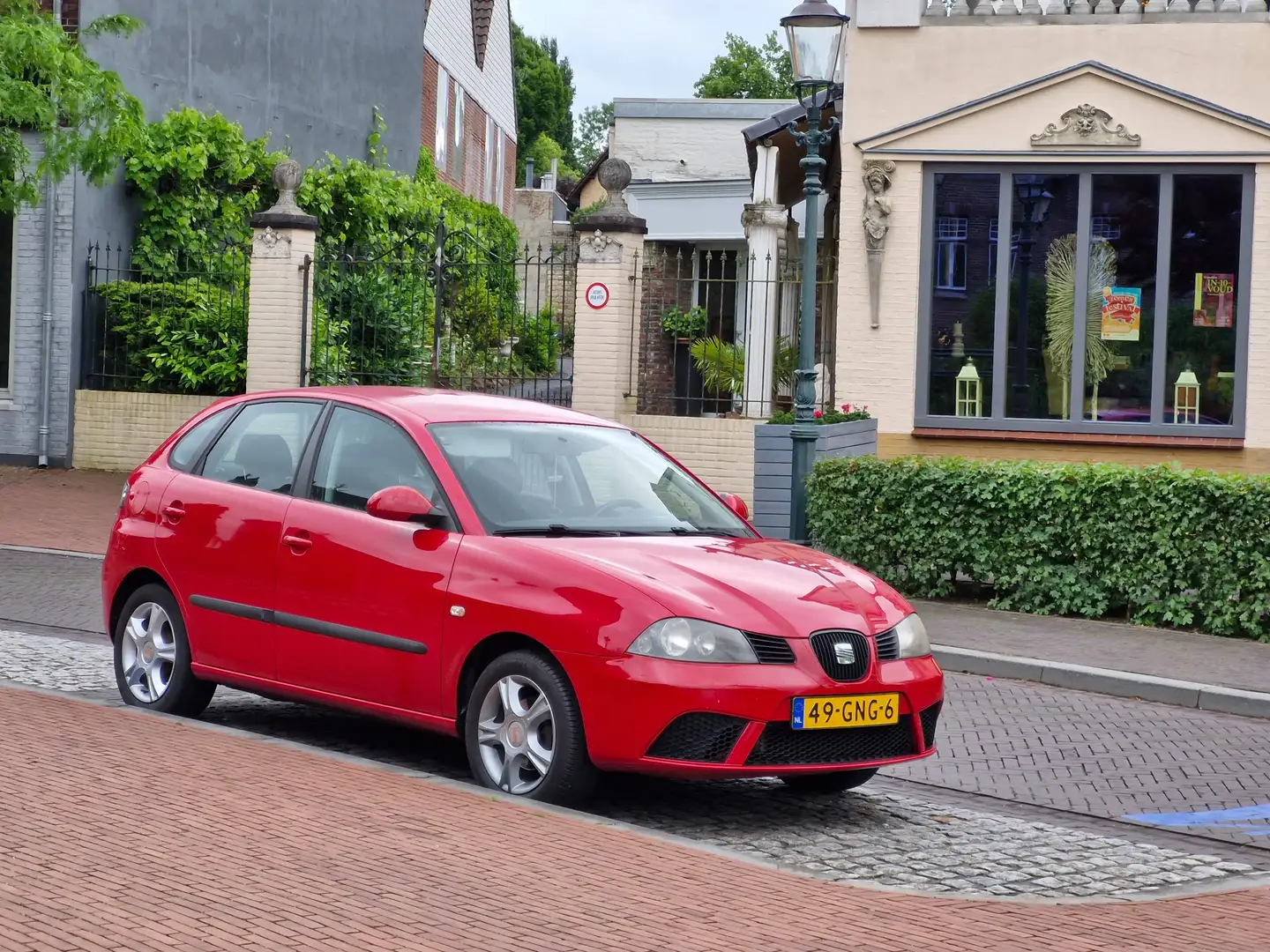 SEAT Ibiza 1.4-16V 25 Edition. Van 1e eigenaar. Airco Cruise Rood - 1