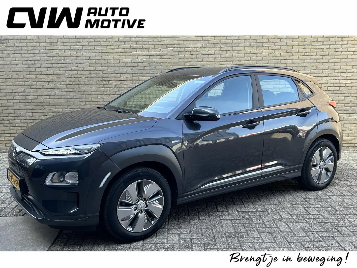 Hyundai KONA EV Comfort 64 kWh | 100% SOH | Adaptieve cruise | Grijs - 1
