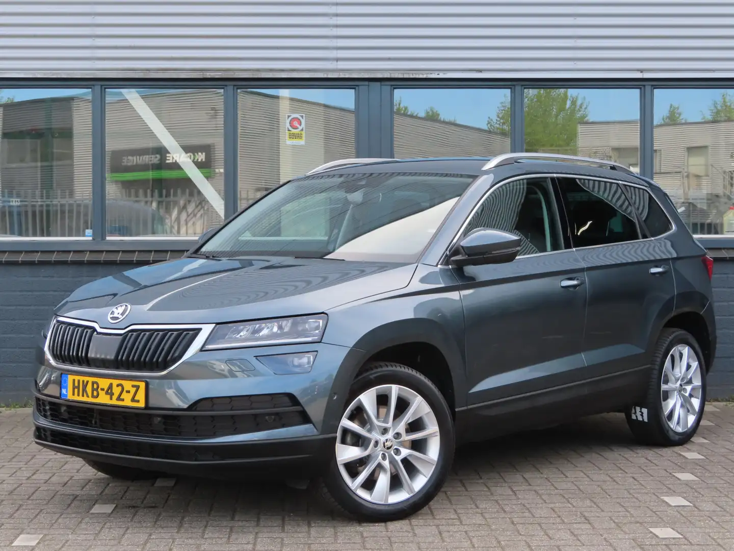 Skoda Karoq 1.5 TSI ACT Style DSG | trekhaak wegklapbaar | ver Gris - 1