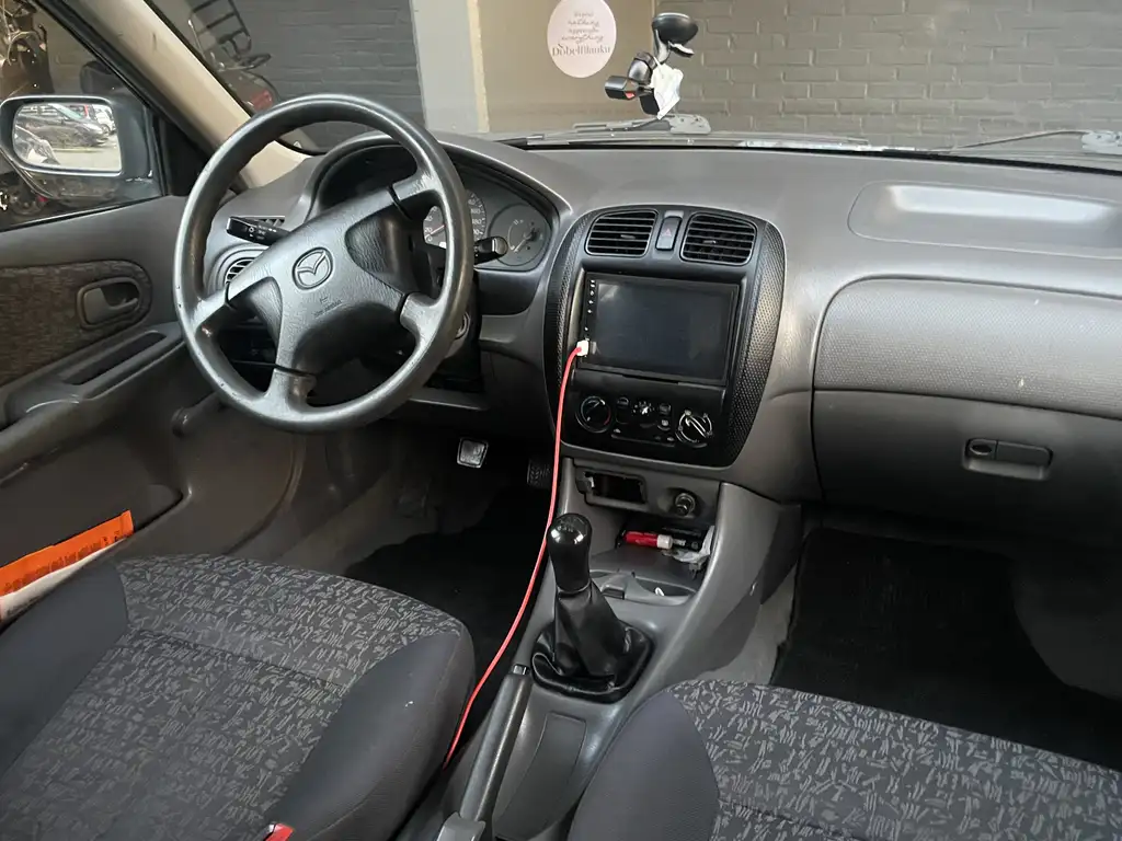 Mazda 323 1999 из Европы — купить под ключ