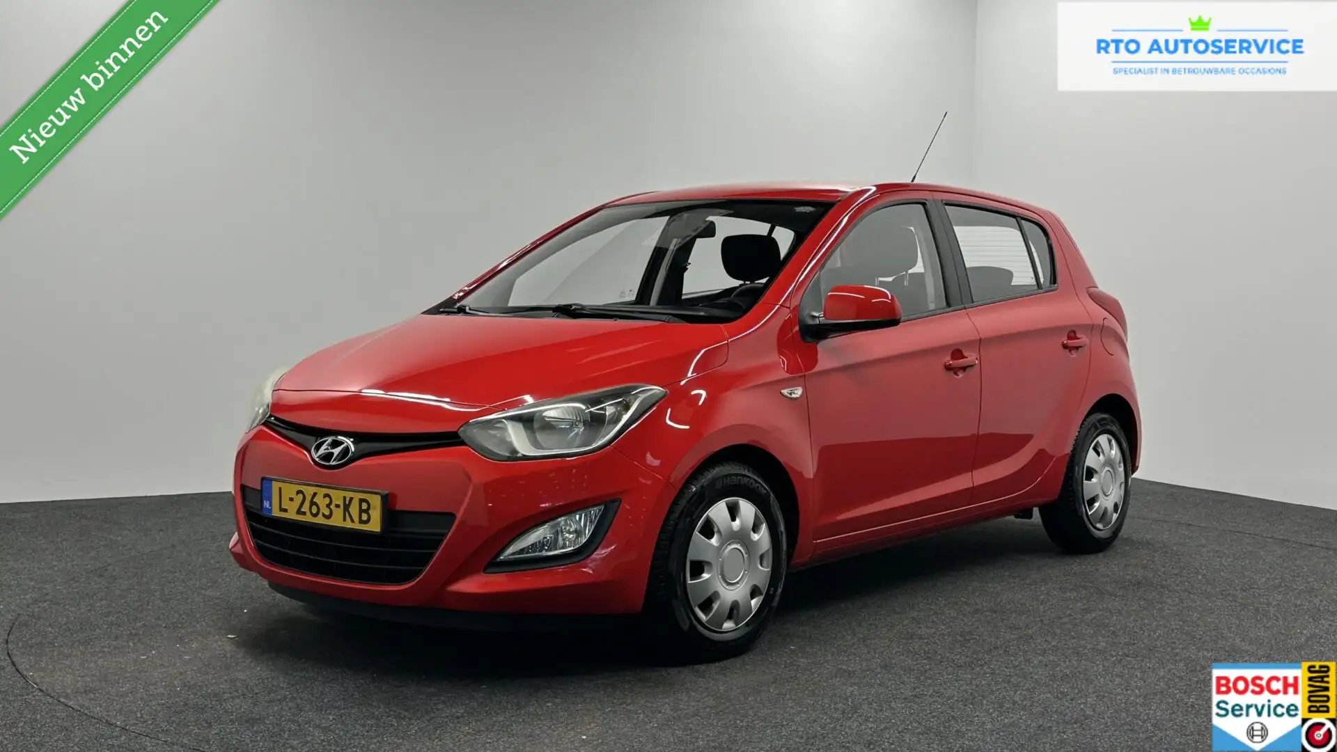 Hyundai i20 1.2i i-Drive AIRCO 5 DEURS. Rood - 1
