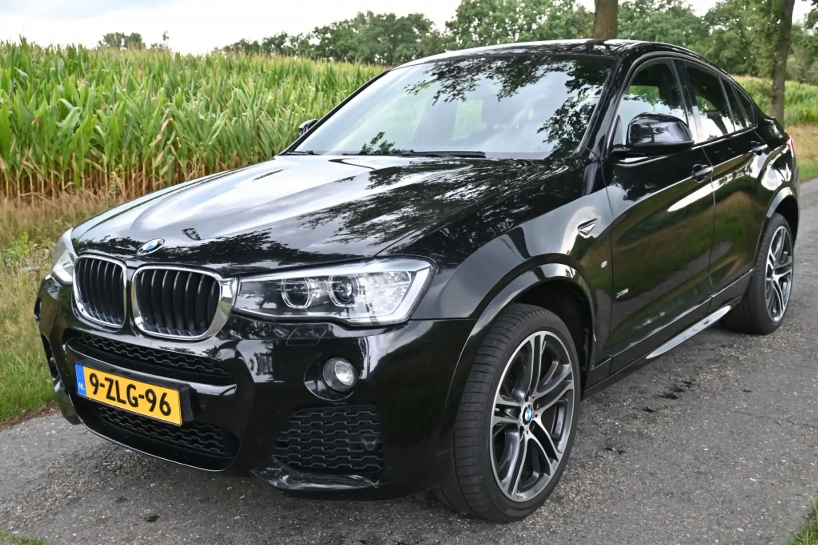 BMW X4 X-Drive20i High Exec. | M-SPORT | NL auto | Leder Zwart - 1
