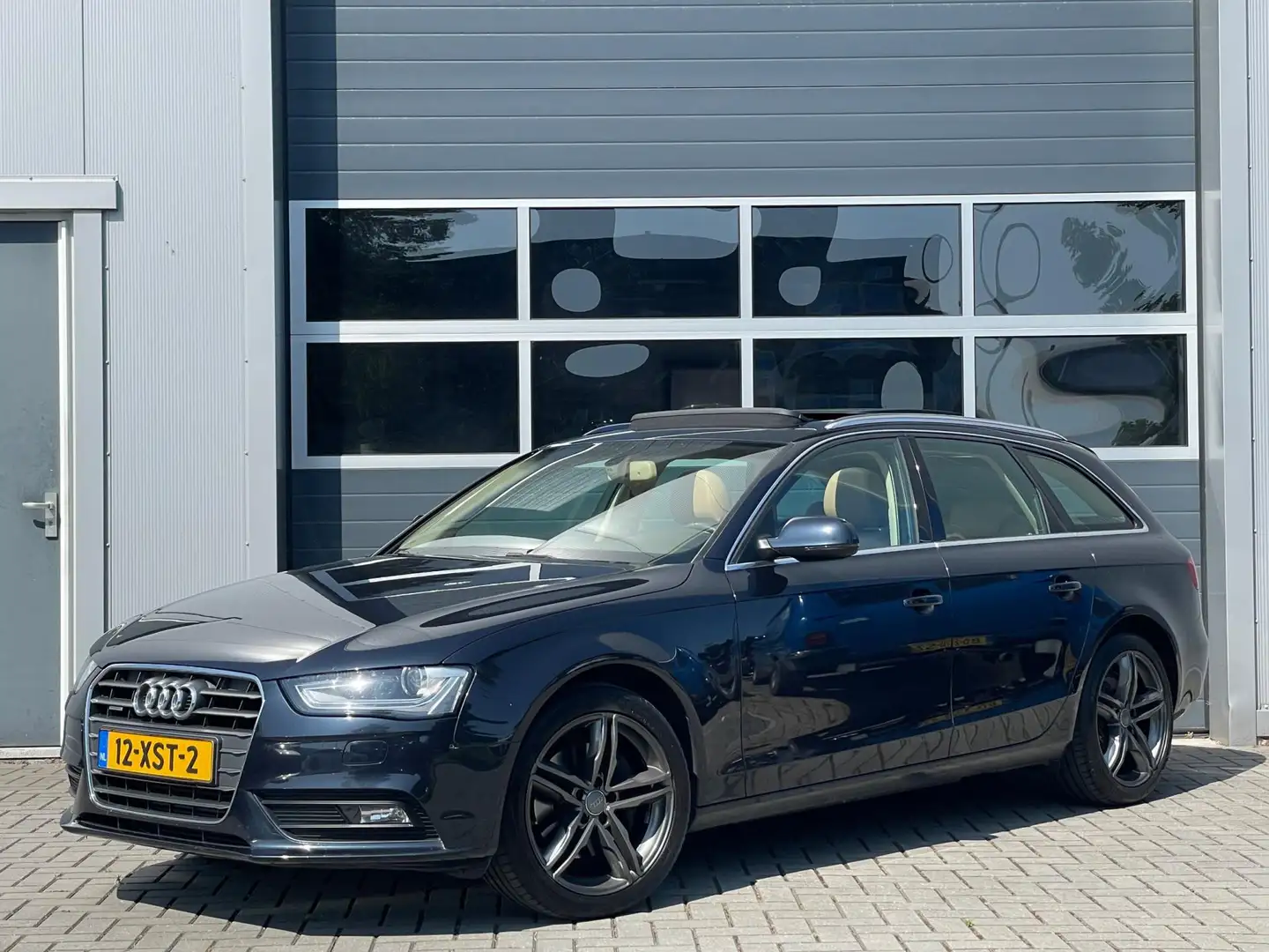 Audi A4 Avant 2.0 TFSI 211pk quattro Pro Line | Panoramada Blauw - 1
