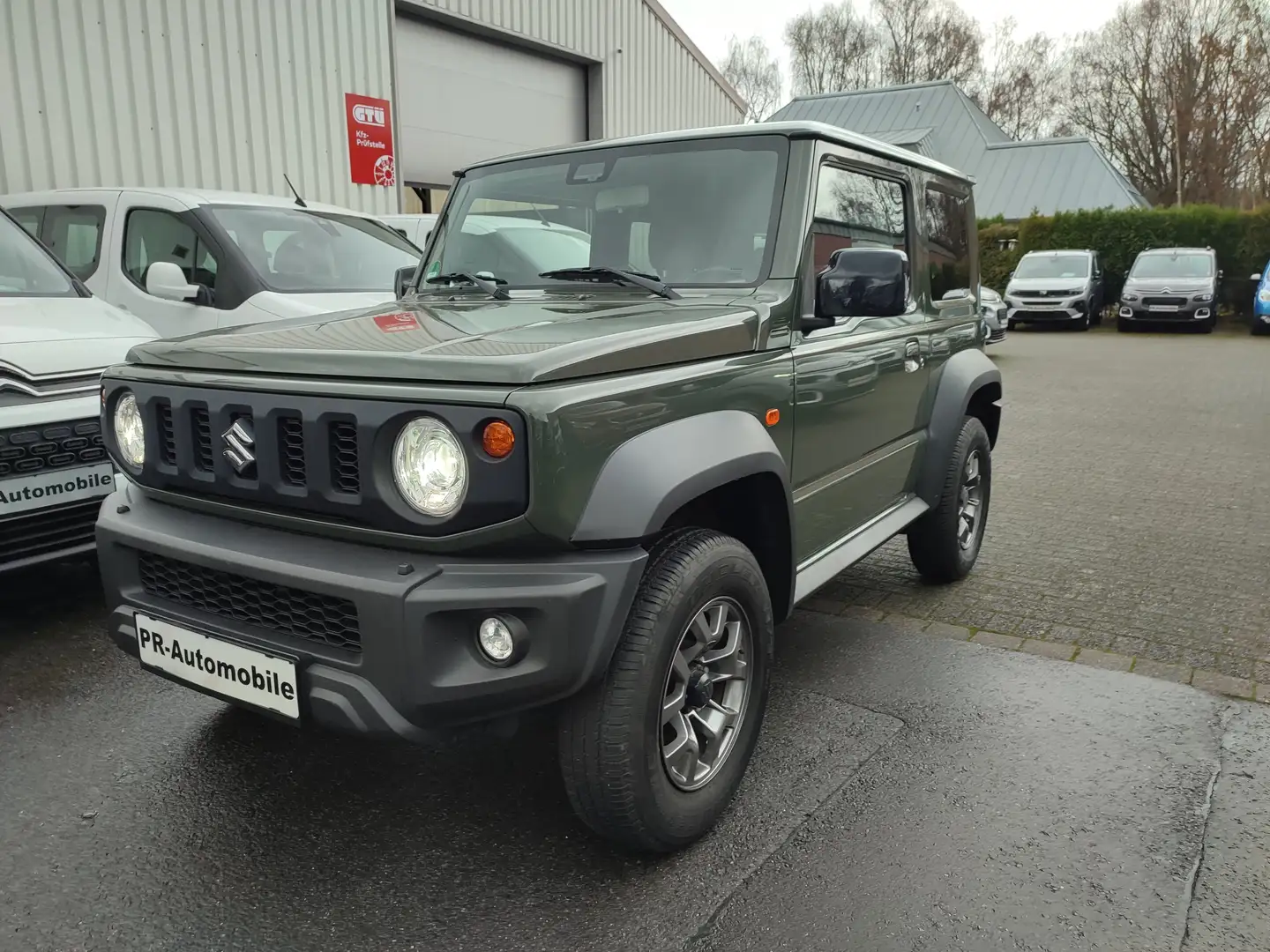 Suzuki Jimny Jimny 1.5 ALLGRIP Comfort+ Klimaaut/Navi+Cam Grün - 1