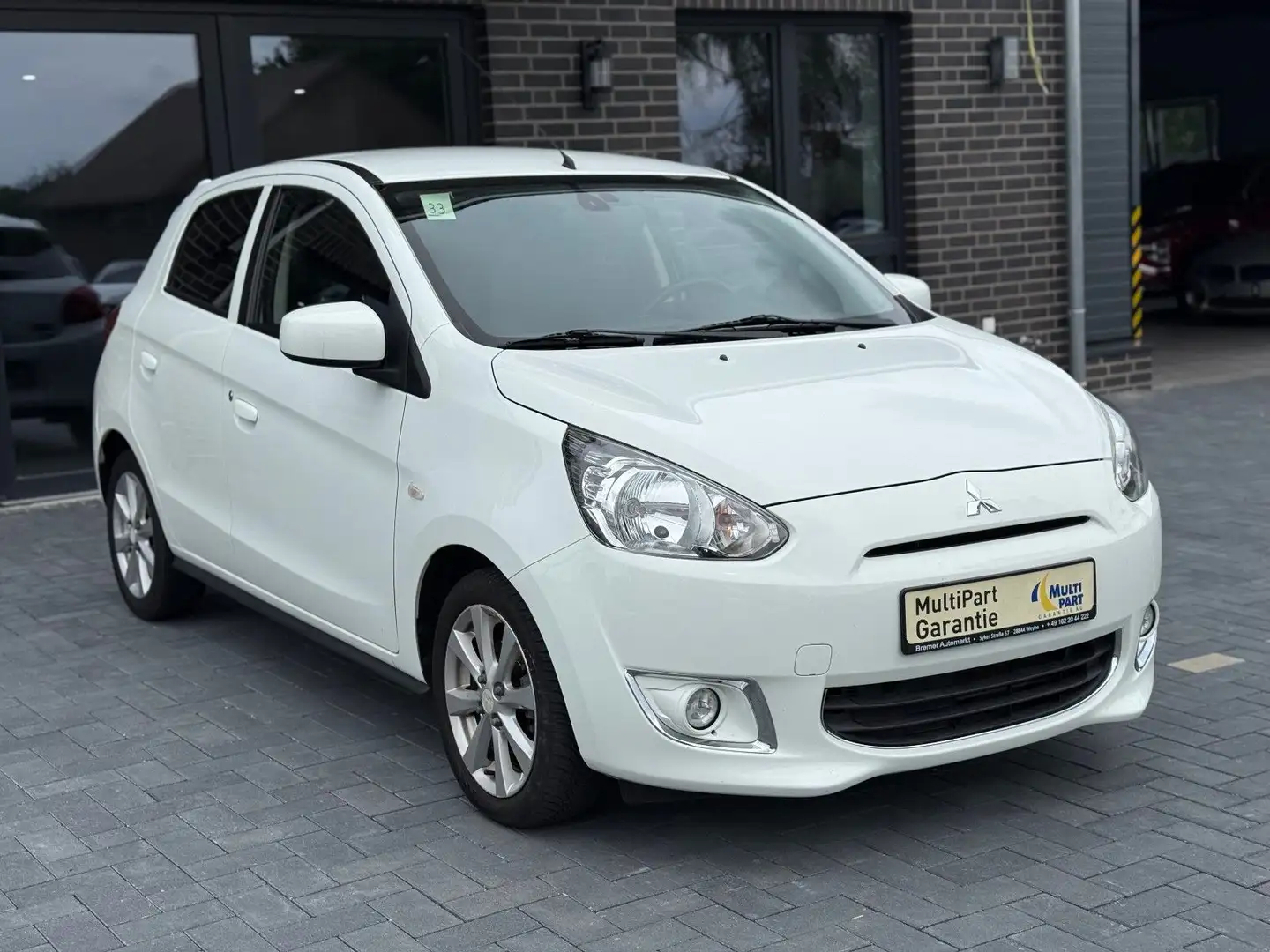 Mitsubishi Space Star Shine+*Navigation*Klimaautomatik*ZV* Weiß - 1