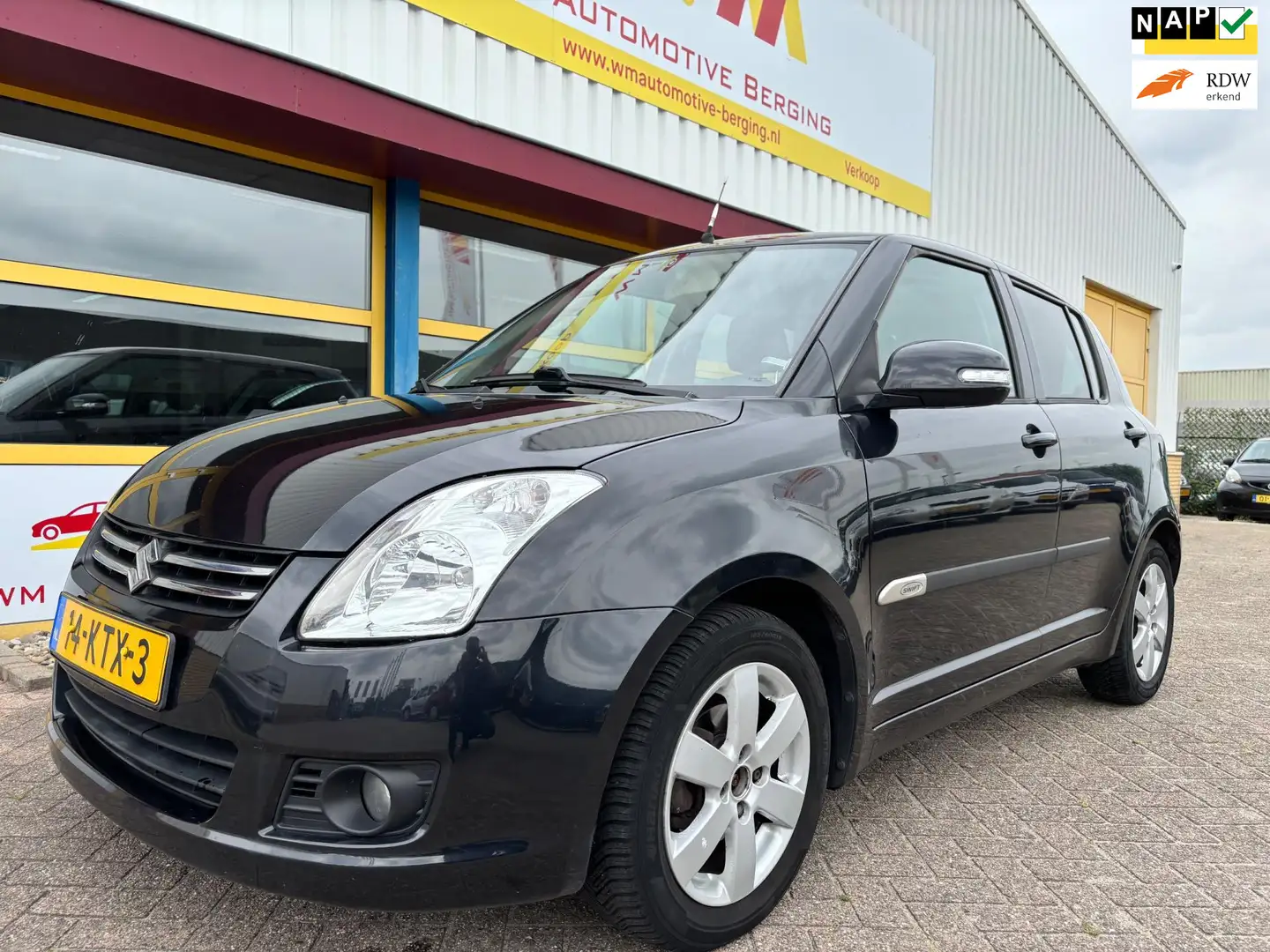 Suzuki Swift 1.3 Limited AIRCO NAVI Zwart - 1