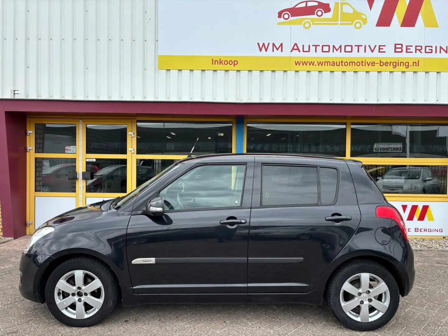 Suzuki Swift 1.3 Limited AIRCO NAVI Zwart - 2