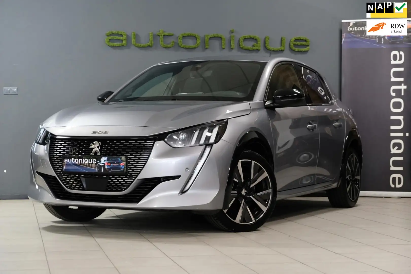 Peugeot 208 1.2 PureTech GT Line *30.823km* Sport/Comfort Inte Grau - 1