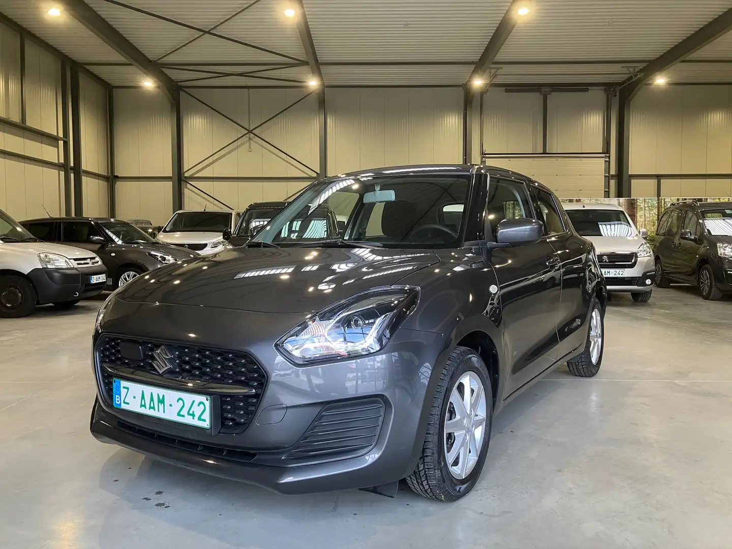 Suzuki Swift 1,2 HYBRID Airco...1 Eig fabrieksgarantie tot 2030 Gris - 1