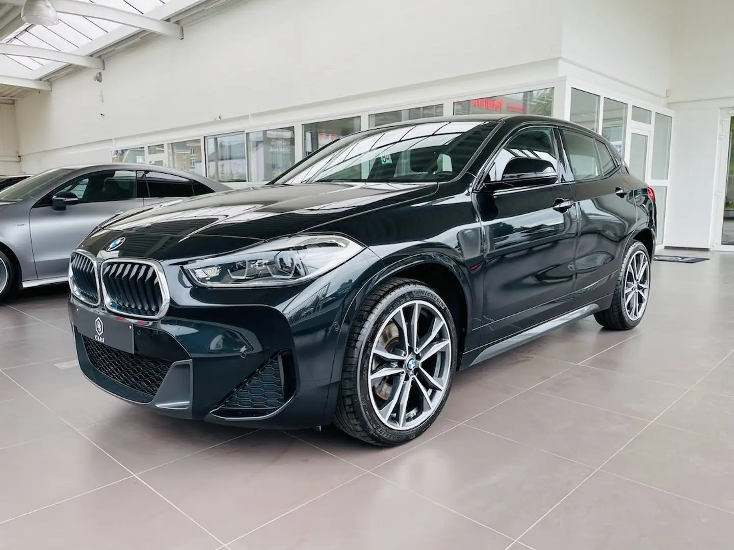 BMW X2 2.0 dA *** GARANTIE + PACK M + LED + CUIR + GPS ** Zwart - 1