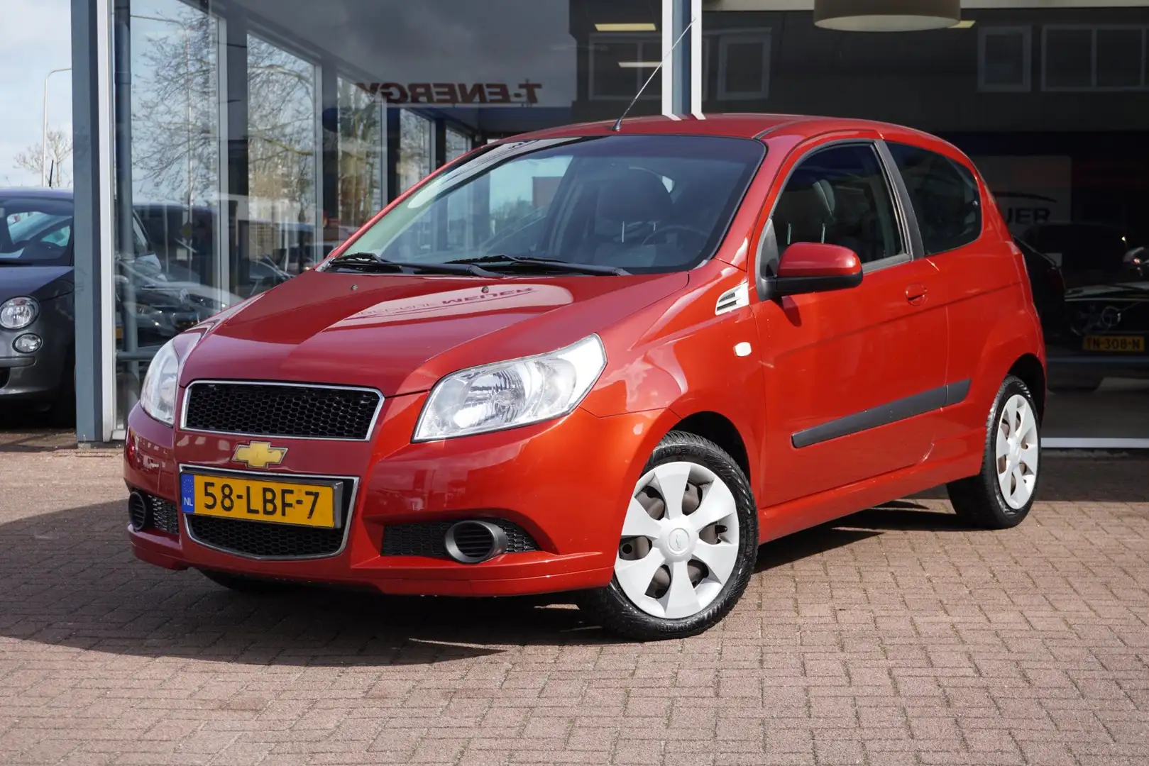Chevrolet Aveo 1.2 16V LS+ 3deurs | Airco | Elek. pakket | 2010 | Rojo - 1