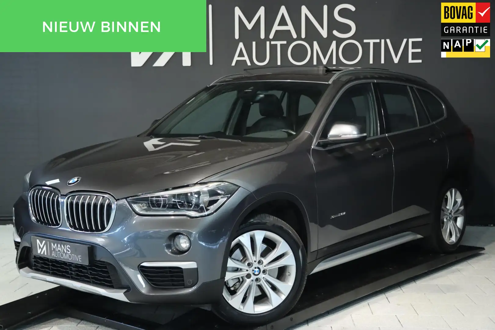 BMW X1 XDrive20i M Sport / PANODAK / MEMORY / HUD / H&K / Grijs - 1
