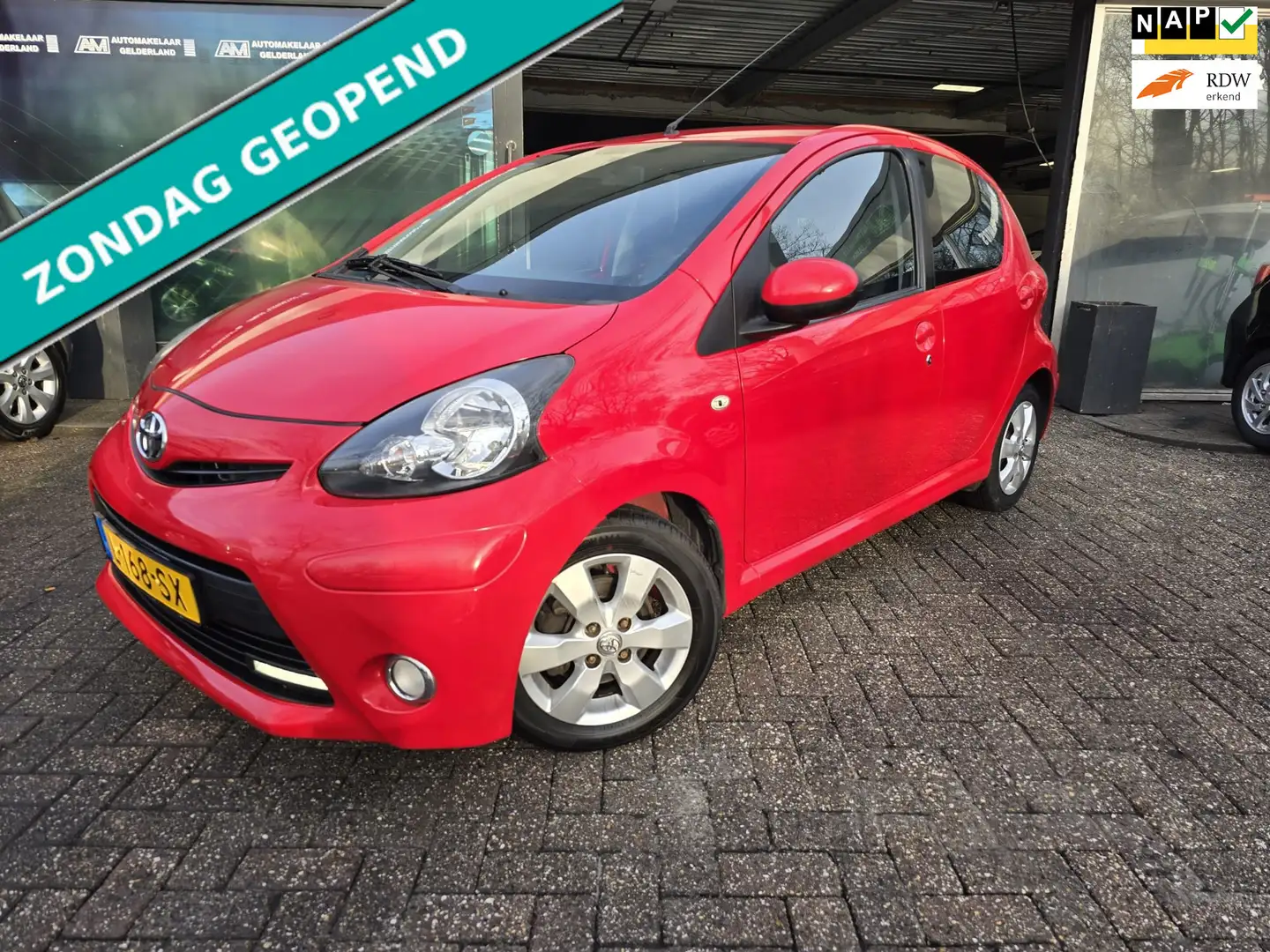 Toyota Aygo 1.0-12V Sport | 12MND GARANTIE | AIRCO | NW APK | Rojo - 1