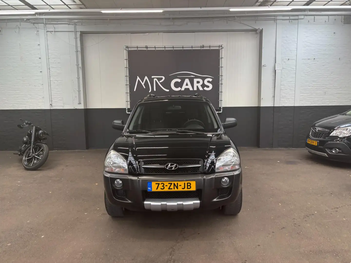Hyundai TUCSON 2.0i Dynamic Cross airco Zwart - 1