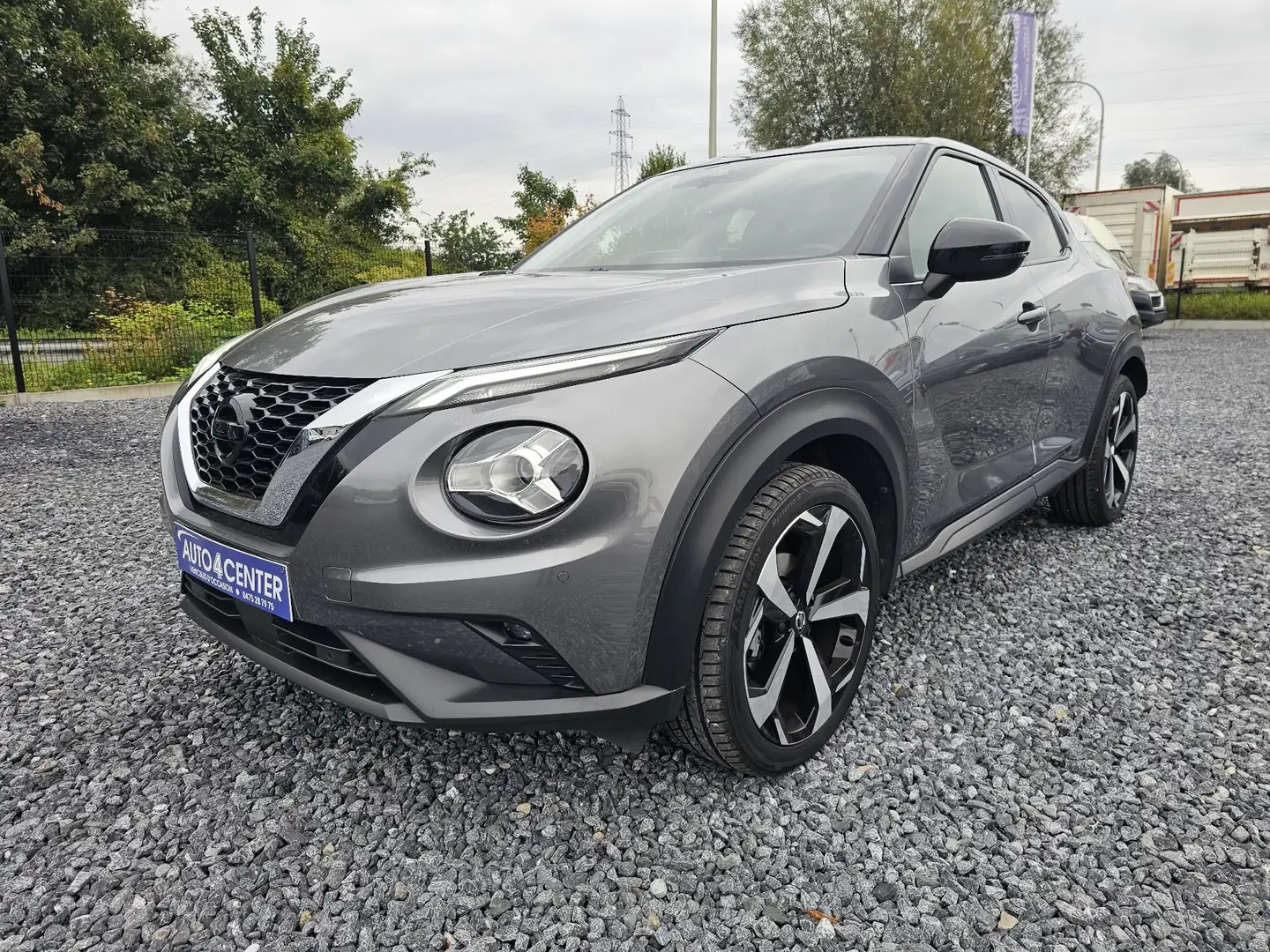 Nissan Juke 1.0 DIG-T 2WD // GPS / GARANTIE 1 AN // Grijs - 1