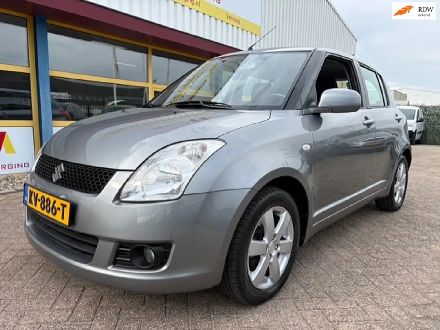 Suzuki Swift 1.3 Comfort AIRCO Grau - 1