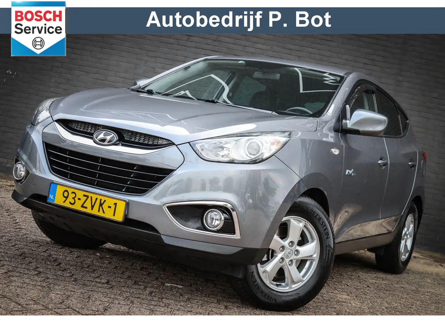 Hyundai iX35 1.6i GDI Dynamic Ned auto/Airco/Trekhaak Grijs - 1
