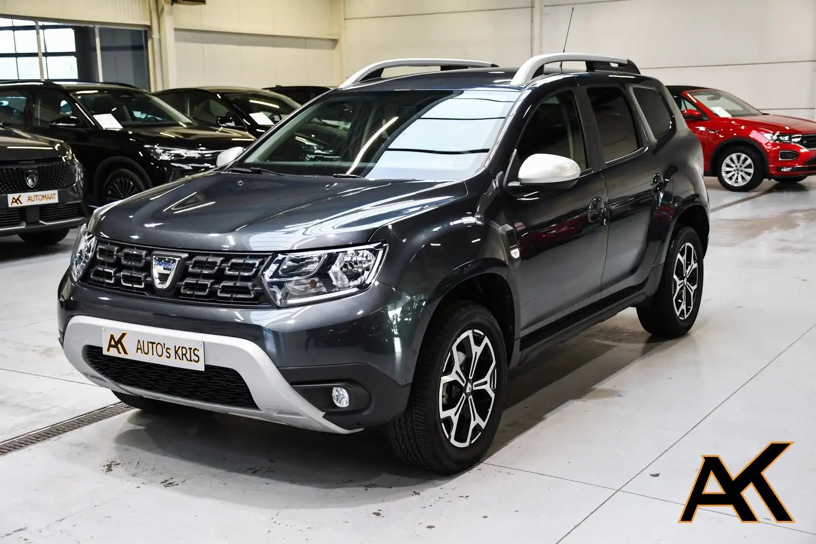 Dacia Duster Duster TCe 1.3i Comfort - NAVIGATIE / CAMERA / PDC Grijs - 1