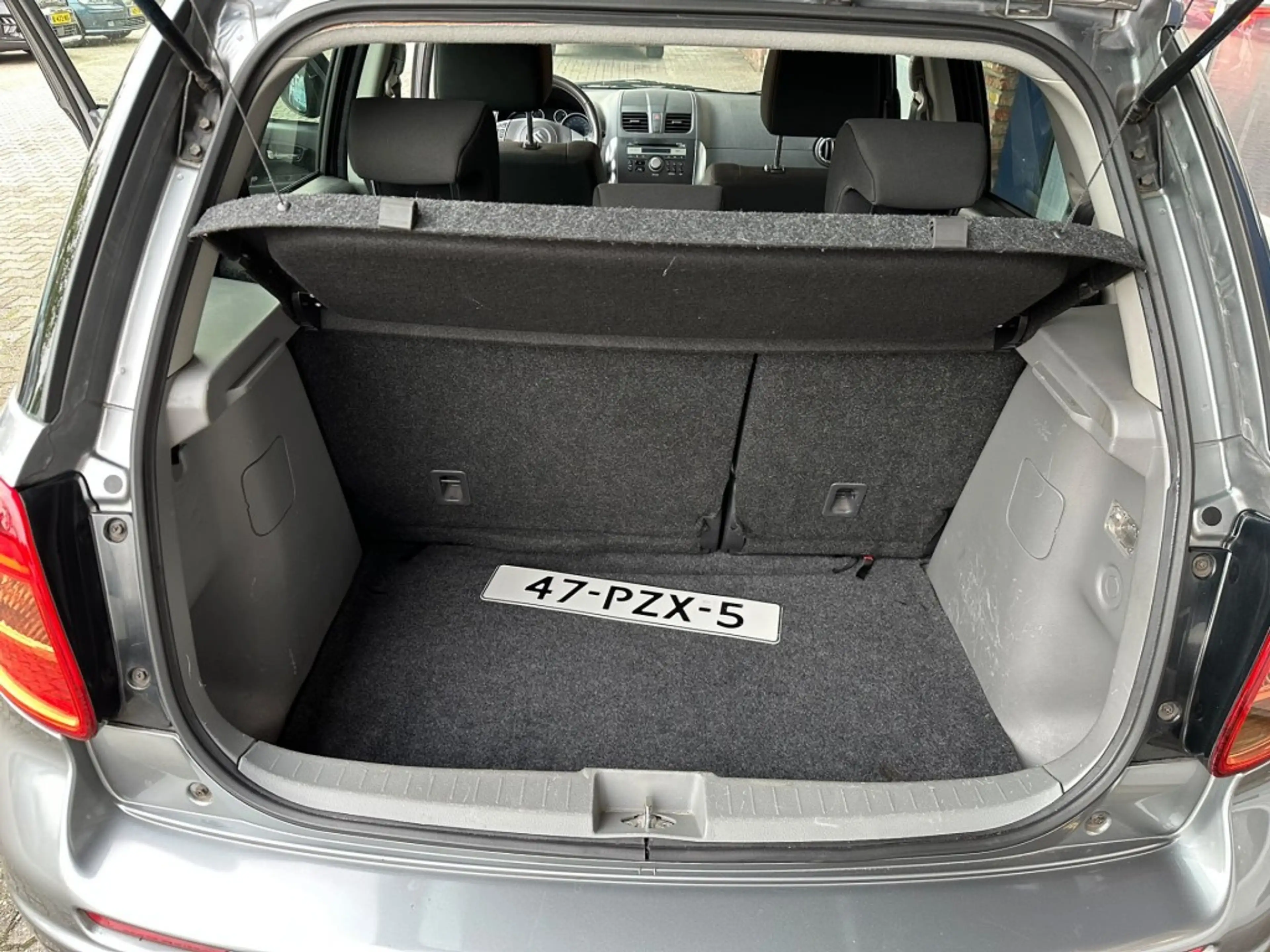 Suzuki SX4 1.6 EXCLUSIVE, Trekhaak, Stoelverwarming, Keyless, — photo 13