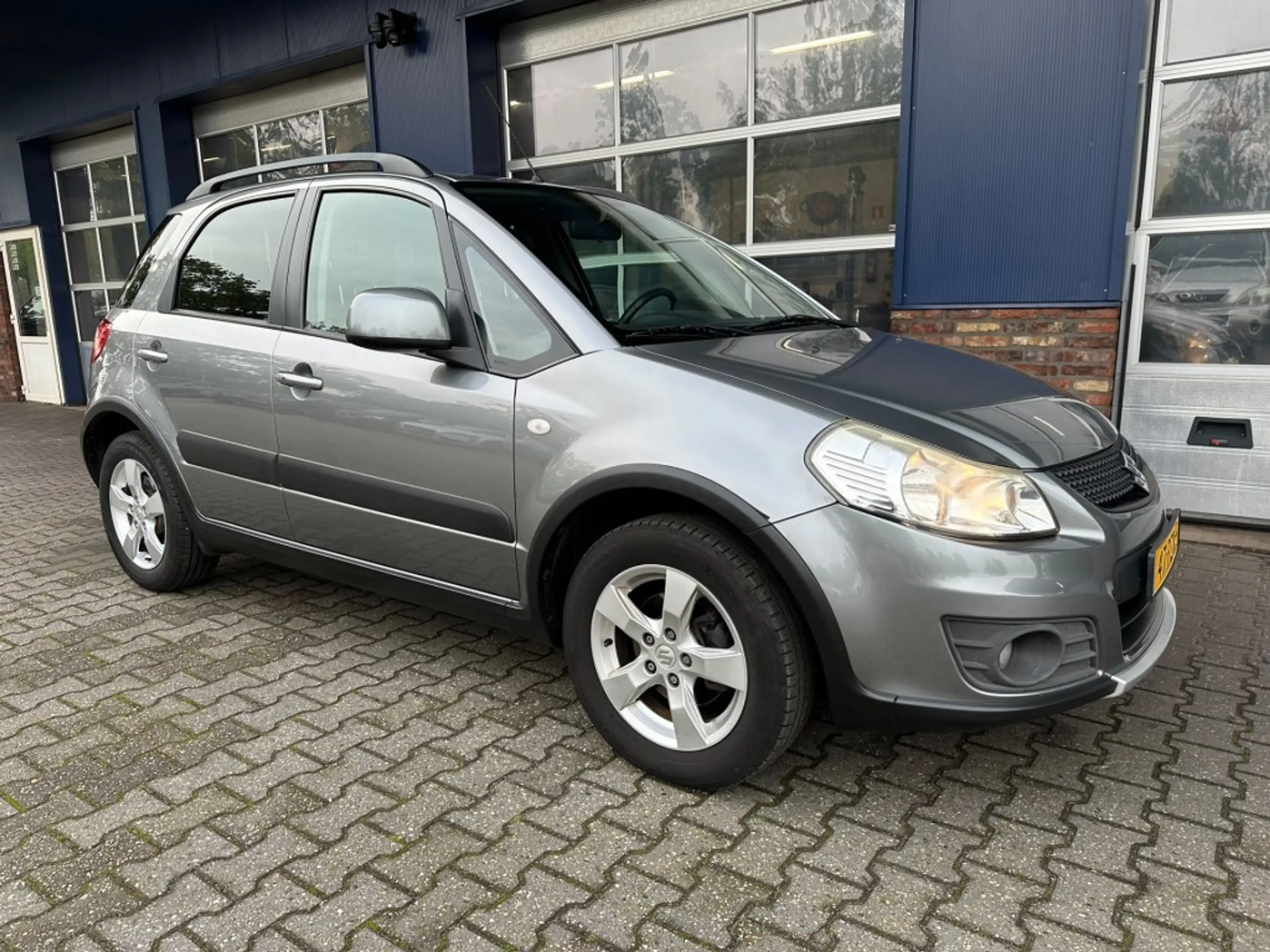 Suzuki SX4 1.6 EXCLUSIVE, Trekhaak, Stoelverwarming, Keyless, — photo 5