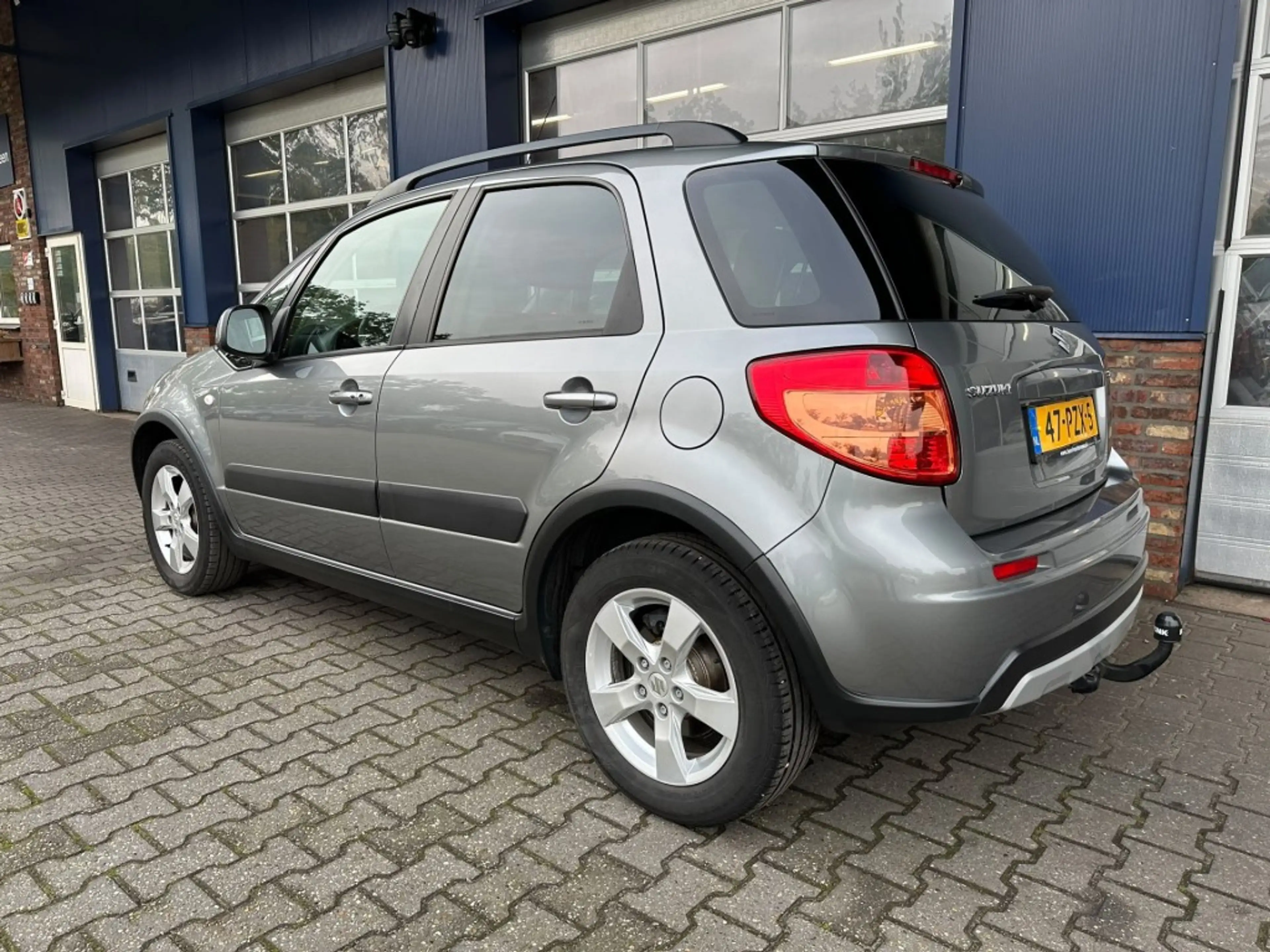 Suzuki SX4 1.6 EXCLUSIVE, Trekhaak, Stoelverwarming, Keyless, — photo 6