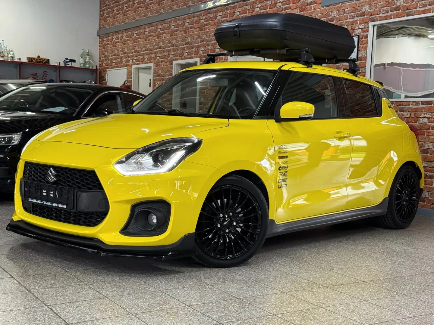 Suzuki Swift Sport-Navi-Kamera-LED- Alu17"-Dachbox-H&R Gelb - 1