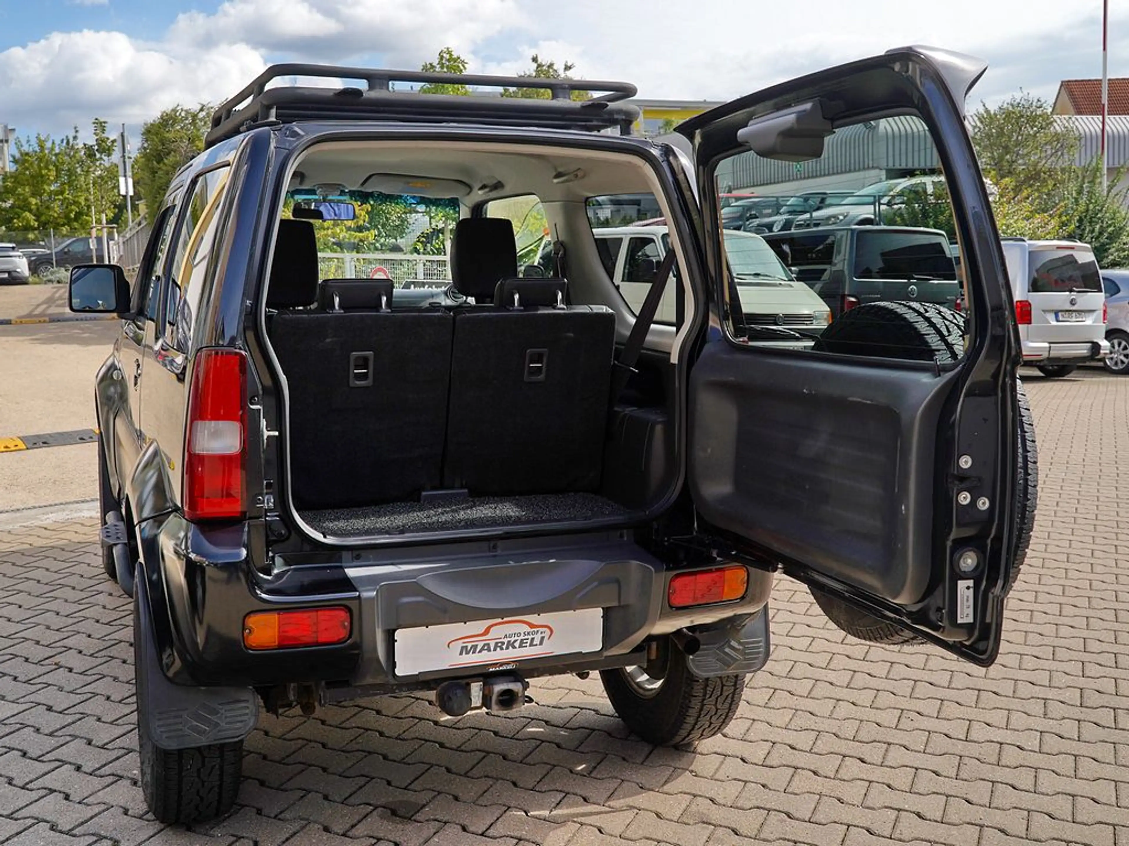 Suzuki Jimny 1.3 Ranger Style 4x4 | Höherlegung m. ABE | US Army Erstbesitz | AHK | Klima | Sitzhzg. — photo 14