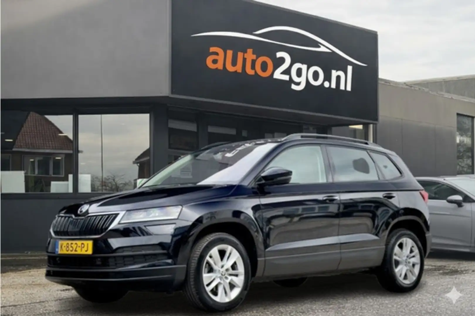 Skoda Karoq 1.5 TSI AUT7/DSG ACT EDITION LEDER NAVI AIRCO PARK Schwarz - 1